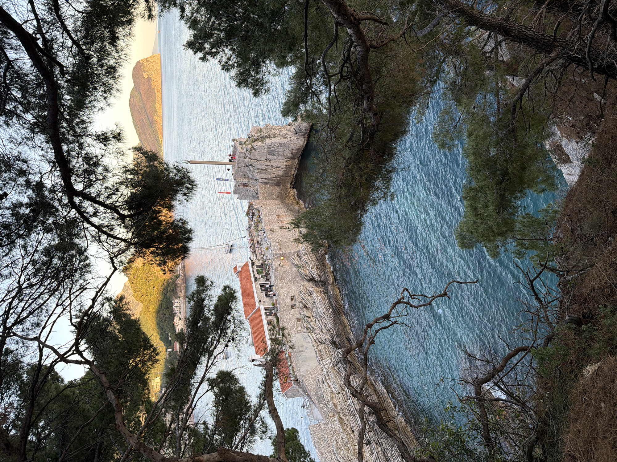 Tourist documents afternoon scenes around Petrovac, Montenegro coastal town