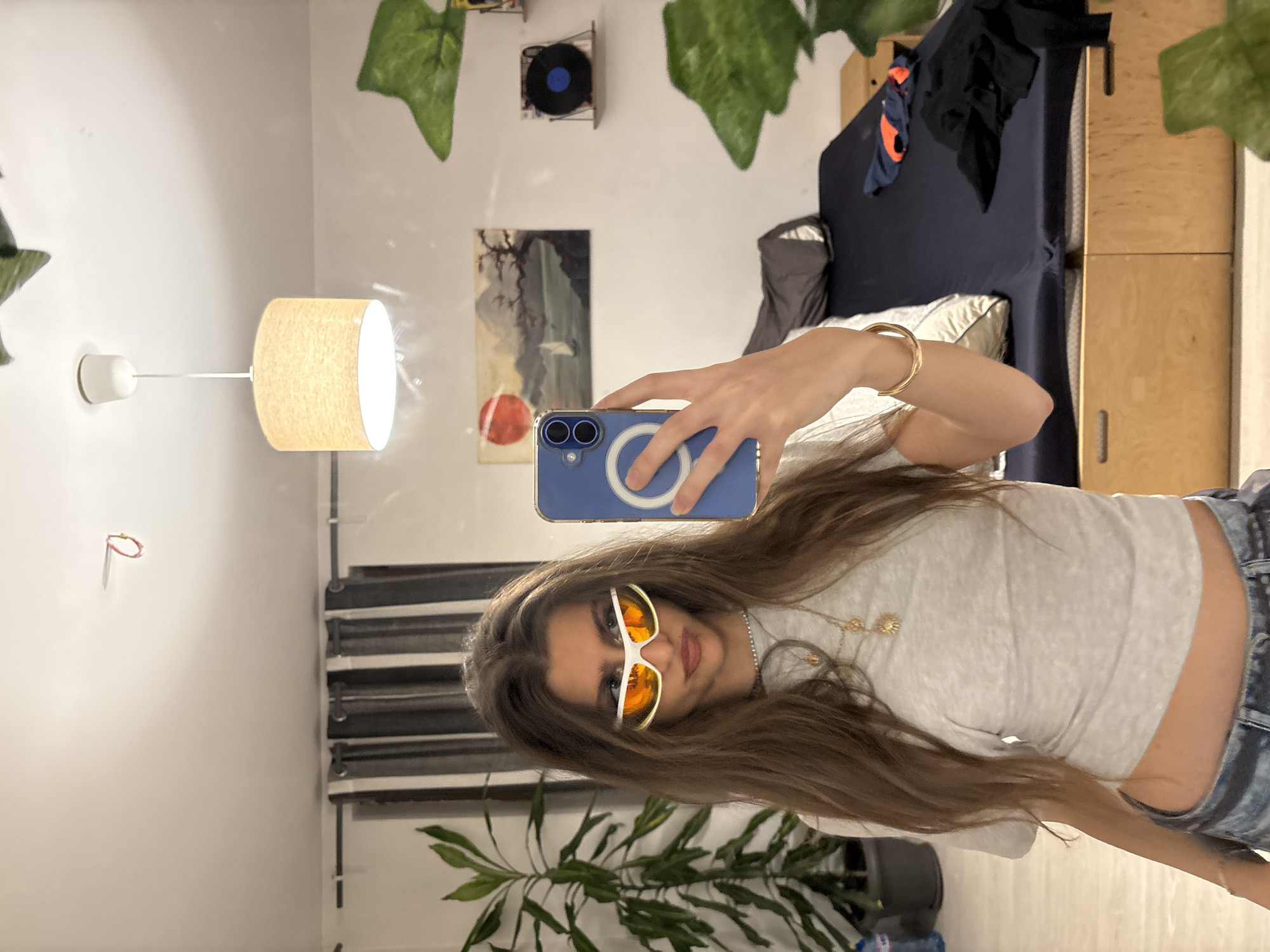 Woman takes selfies in bedroom in Sofia