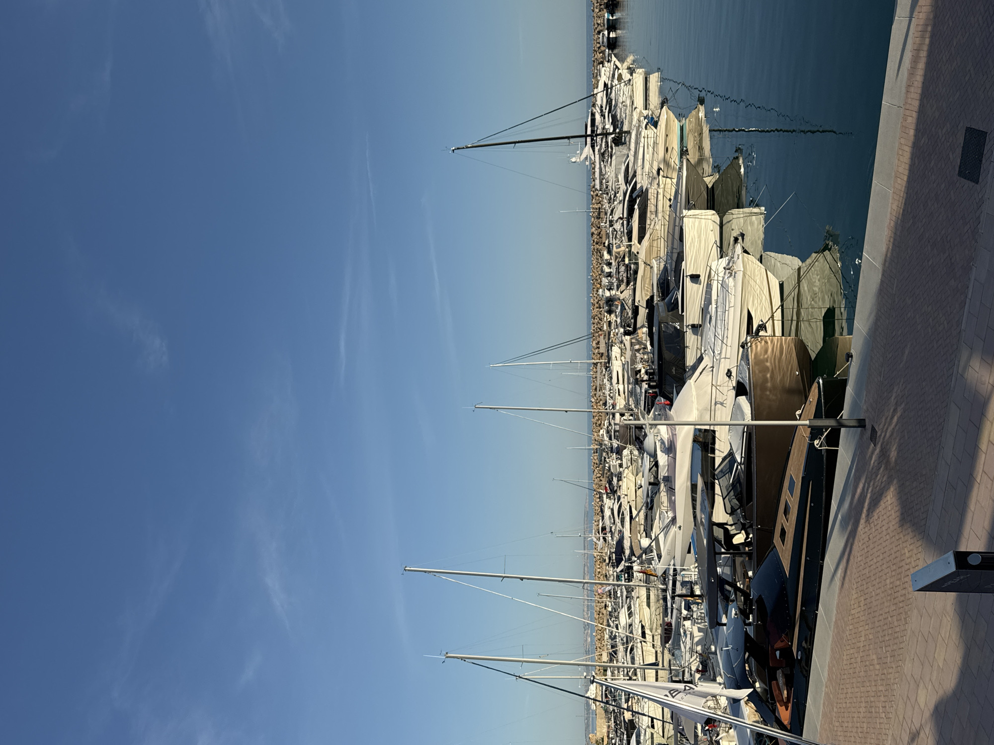 Clear skies frame busy marina scene in Calvià, Spain