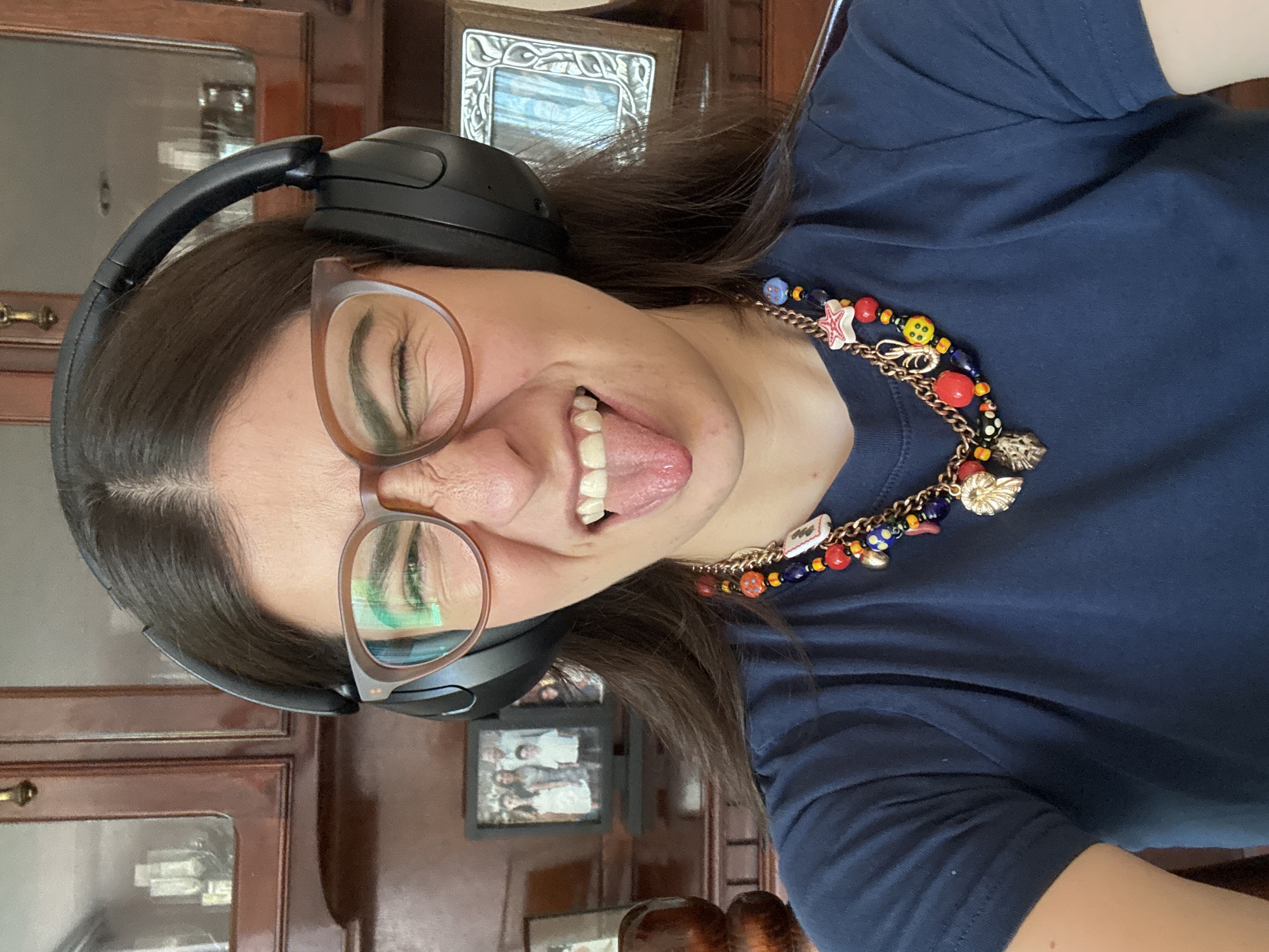 Woman makes playful gestures during apparent video session in Puebla