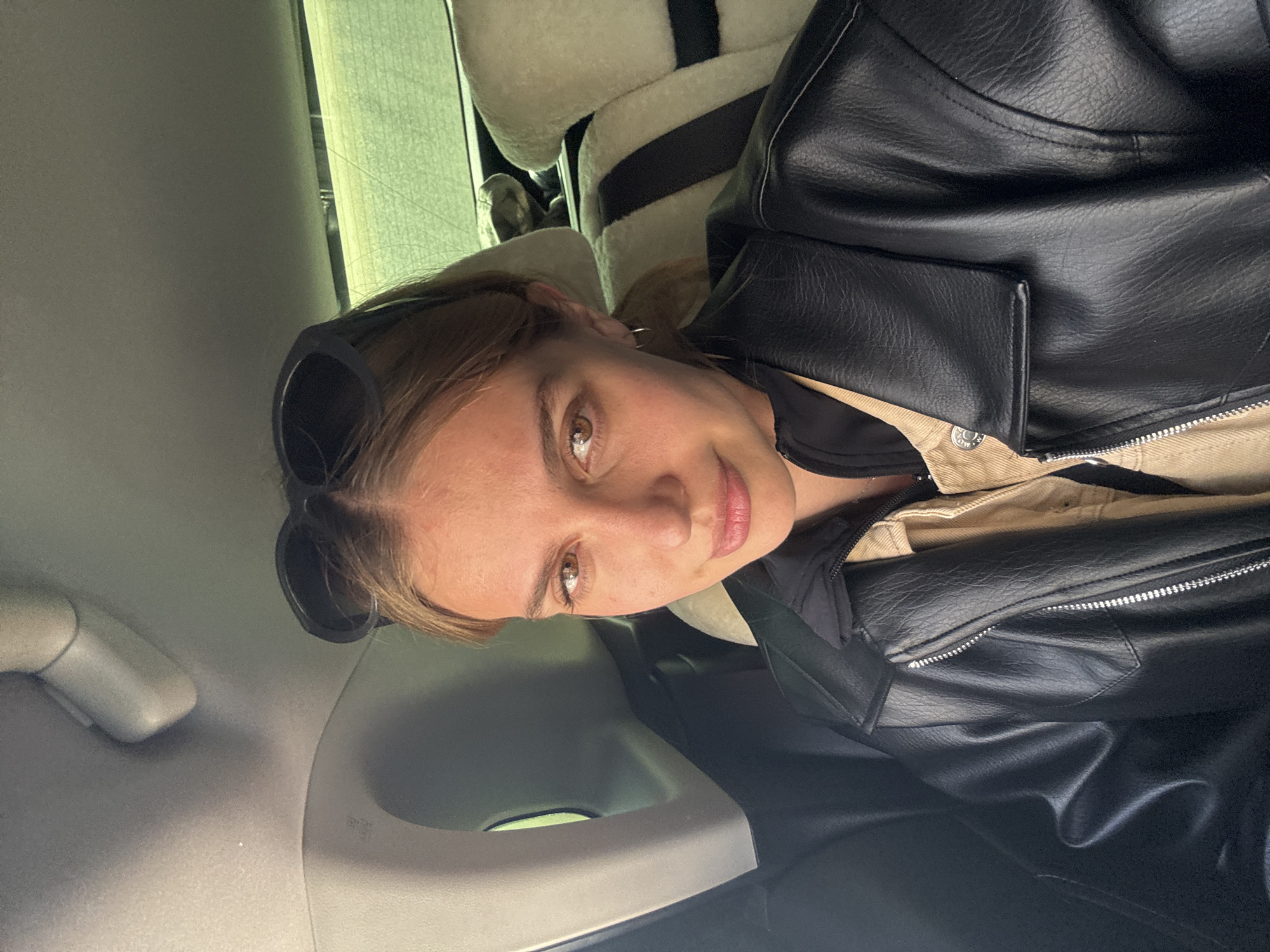 Woman photographed in car interior in Yekaterinburg