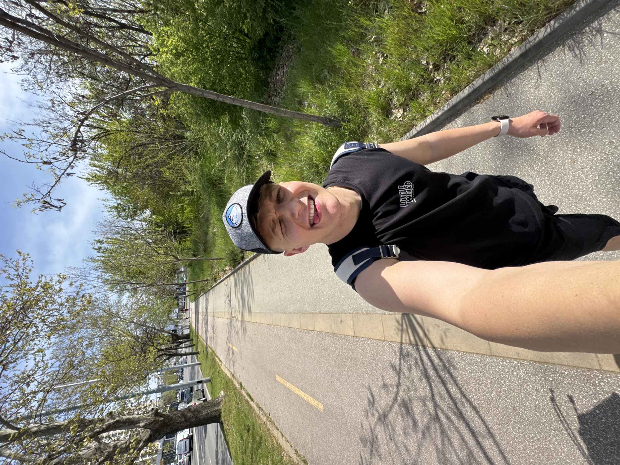 Young man takes playful selfies near red Porsche in Plovdiv
