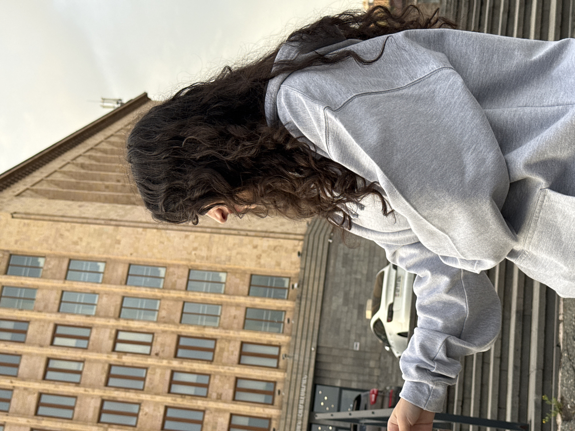 Person in gray hoodie captured in downtown Yerevan