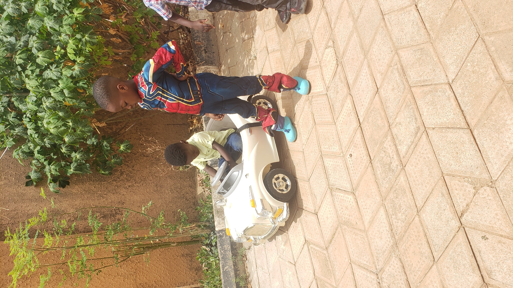 Boys play with toy car in Sabon Tasha