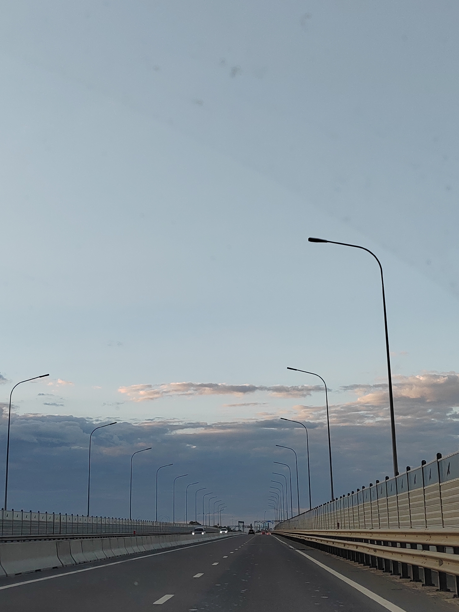 Twilight drive over a Brest highway overpass