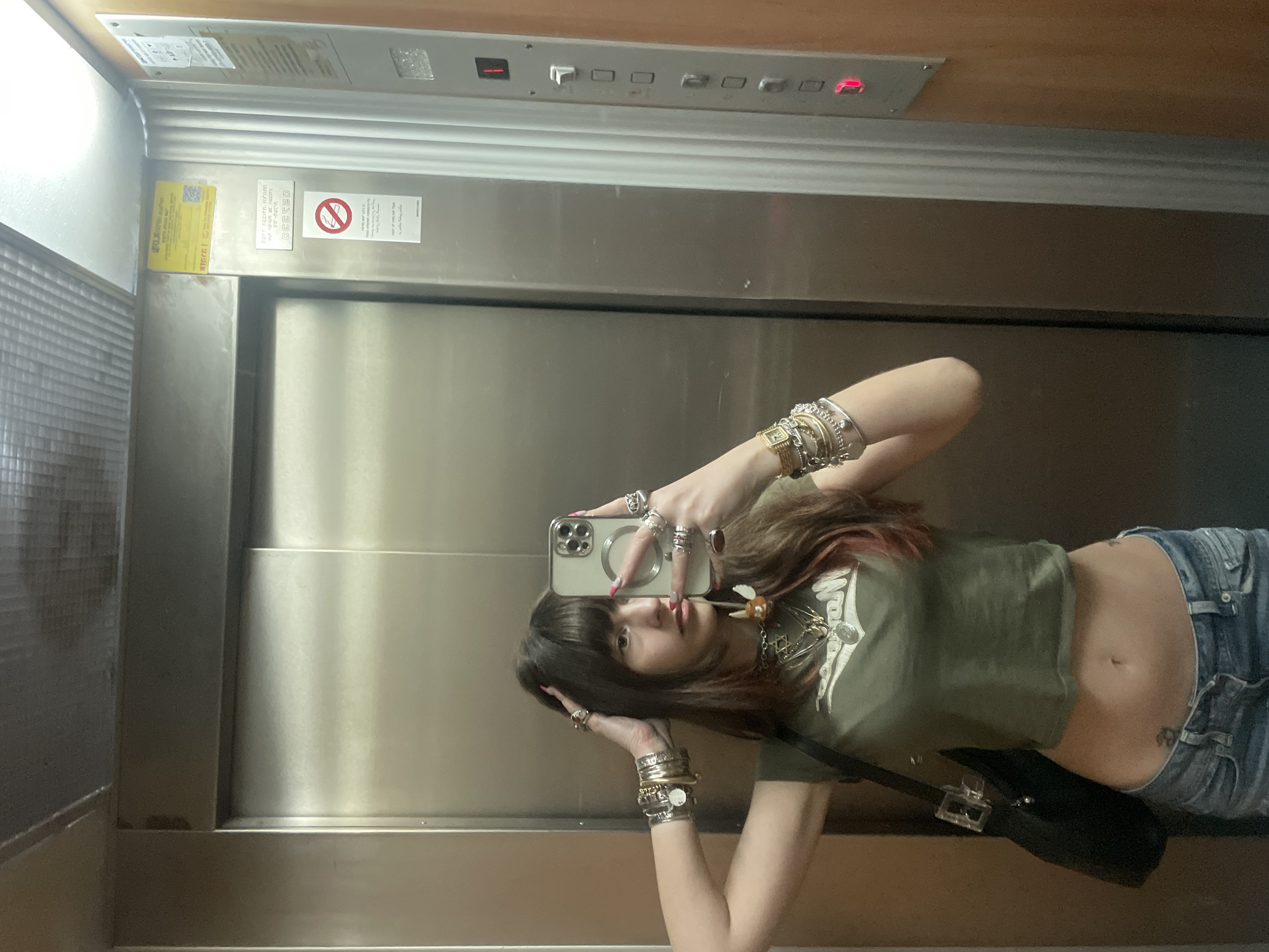 Woman Takes Mirror Selfie in Petah Tikva Elevator