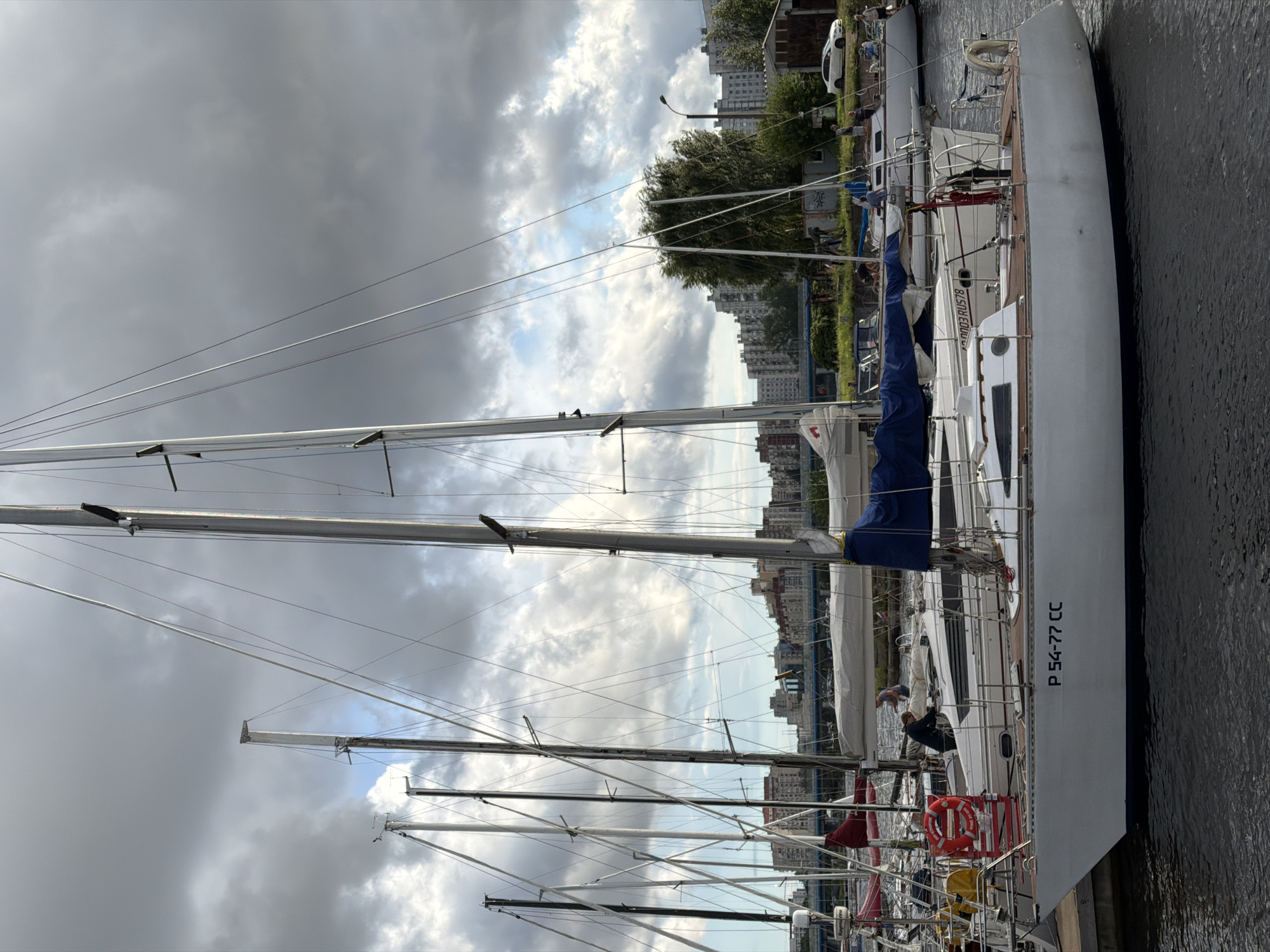 Sailboats moored on the Neva as storm clouds gather