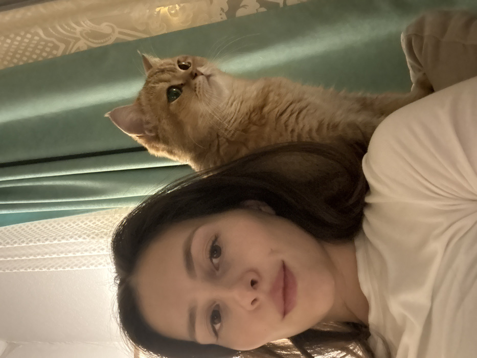 Woman photographed with cat in indoor portraits, Yekaterinburg
