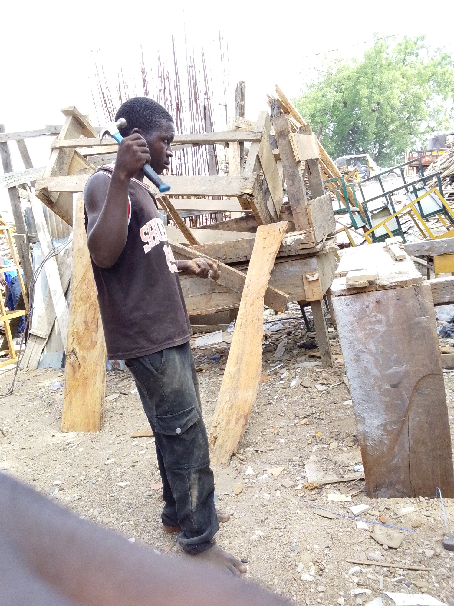 Traditional craftsmen work in outdoor workshops in Jimeta, Nigeria