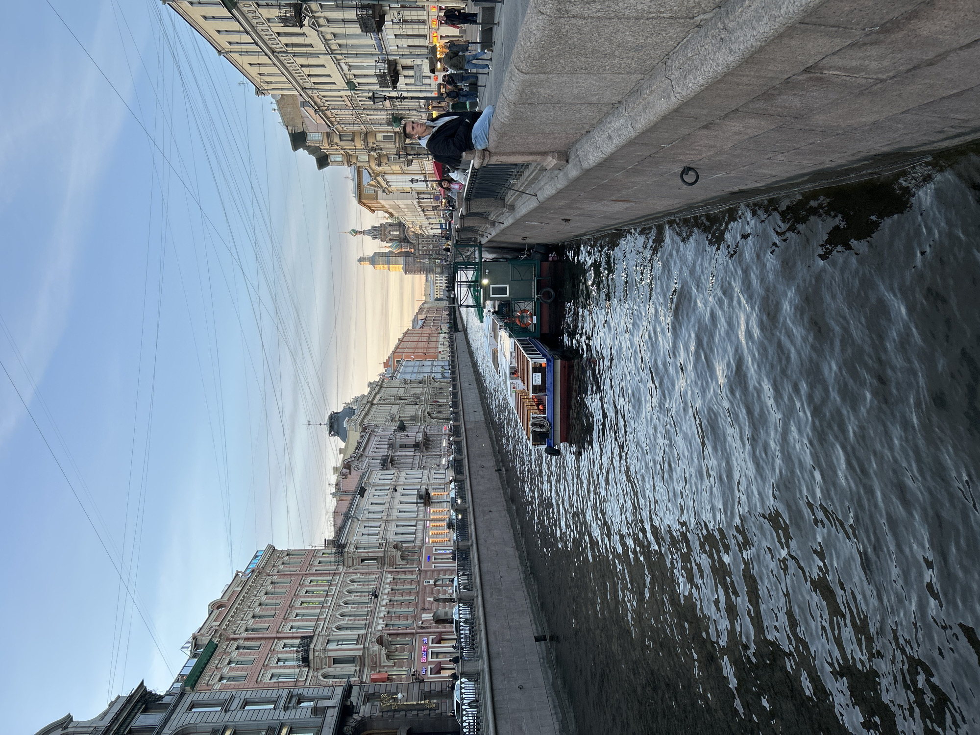 Evening street life documented across central Saint Petersburg landmarks