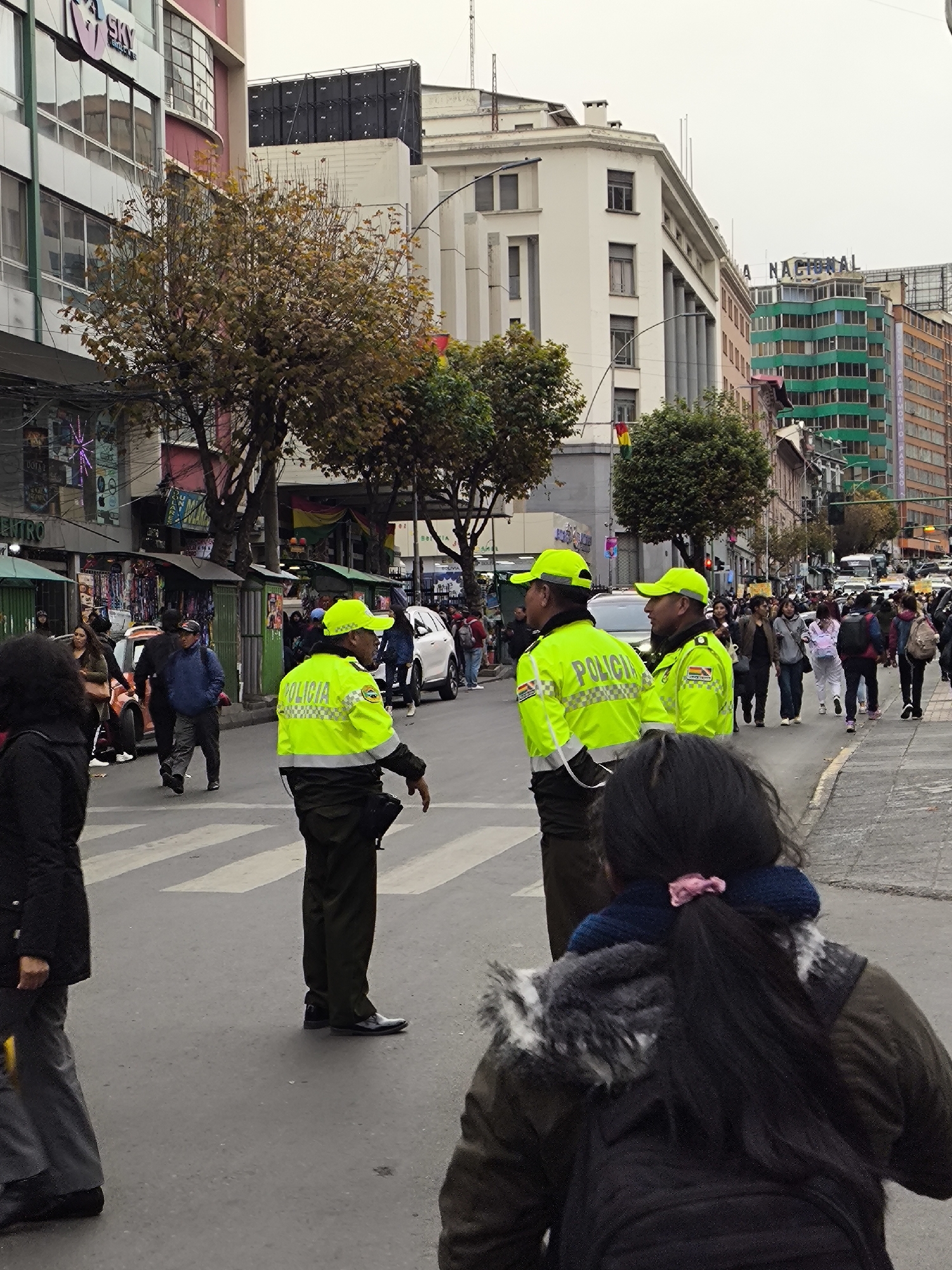 Crowd gathers near Bolivia finance ministry, police direct traffic