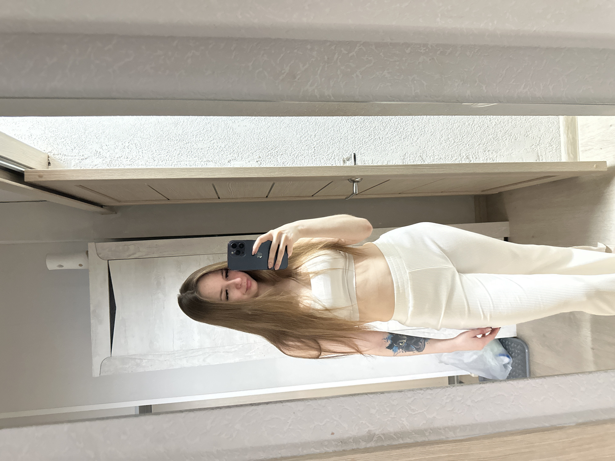 Woman Takes Multiple Mirror Selfies Across Indoor Locations