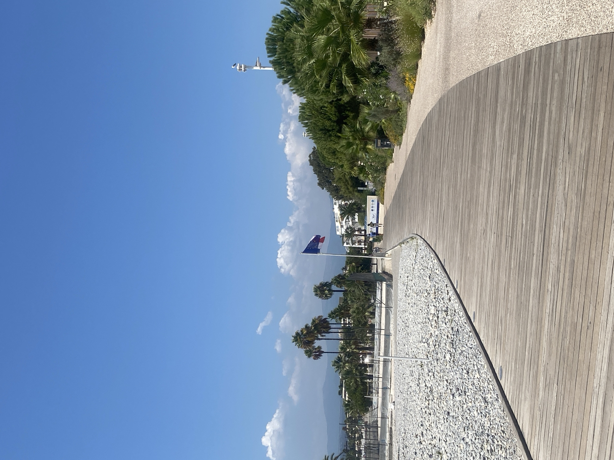 Saint-Laurent-du-Var beachfront boardwalk and cafés, sunny morning
