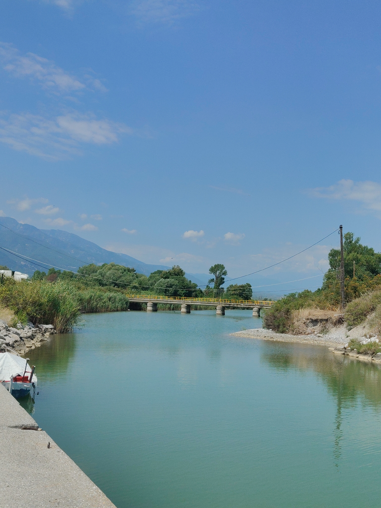 A quiet morning at Litochoro harbor, boats and clear water