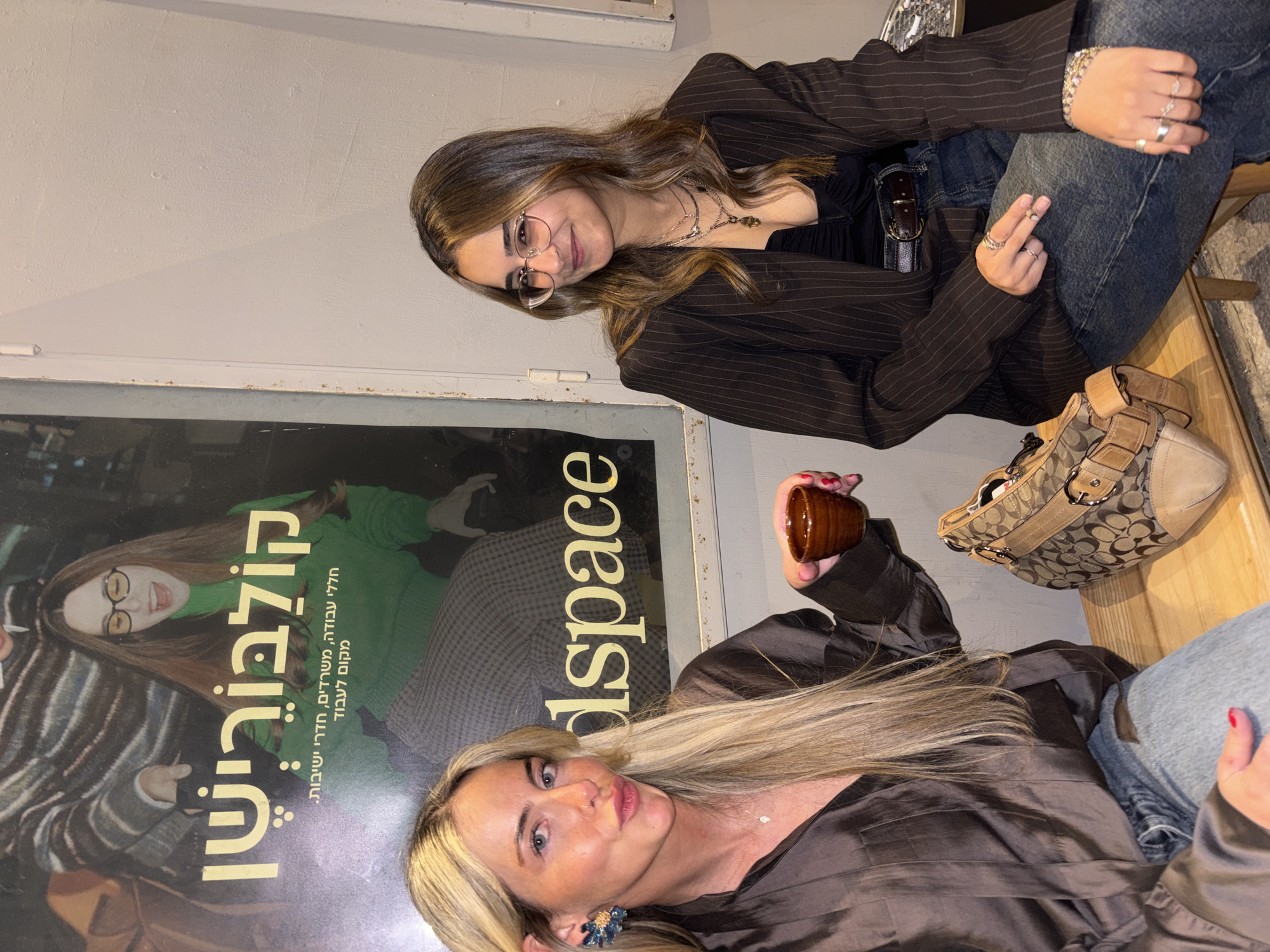 Two women sit together in Tel Aviv