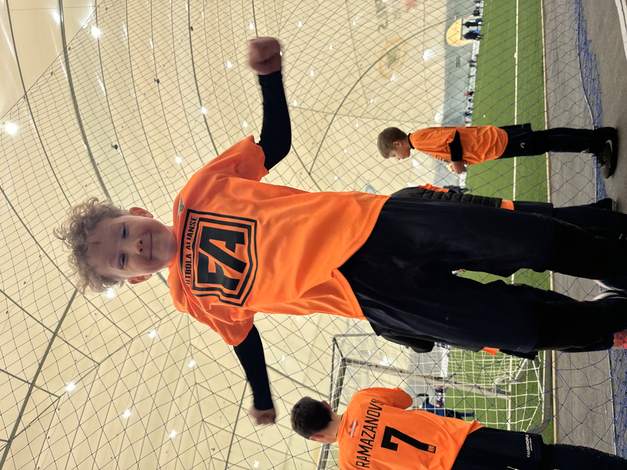 Youth soccer teams practice drills in Daugavpils indoor facility