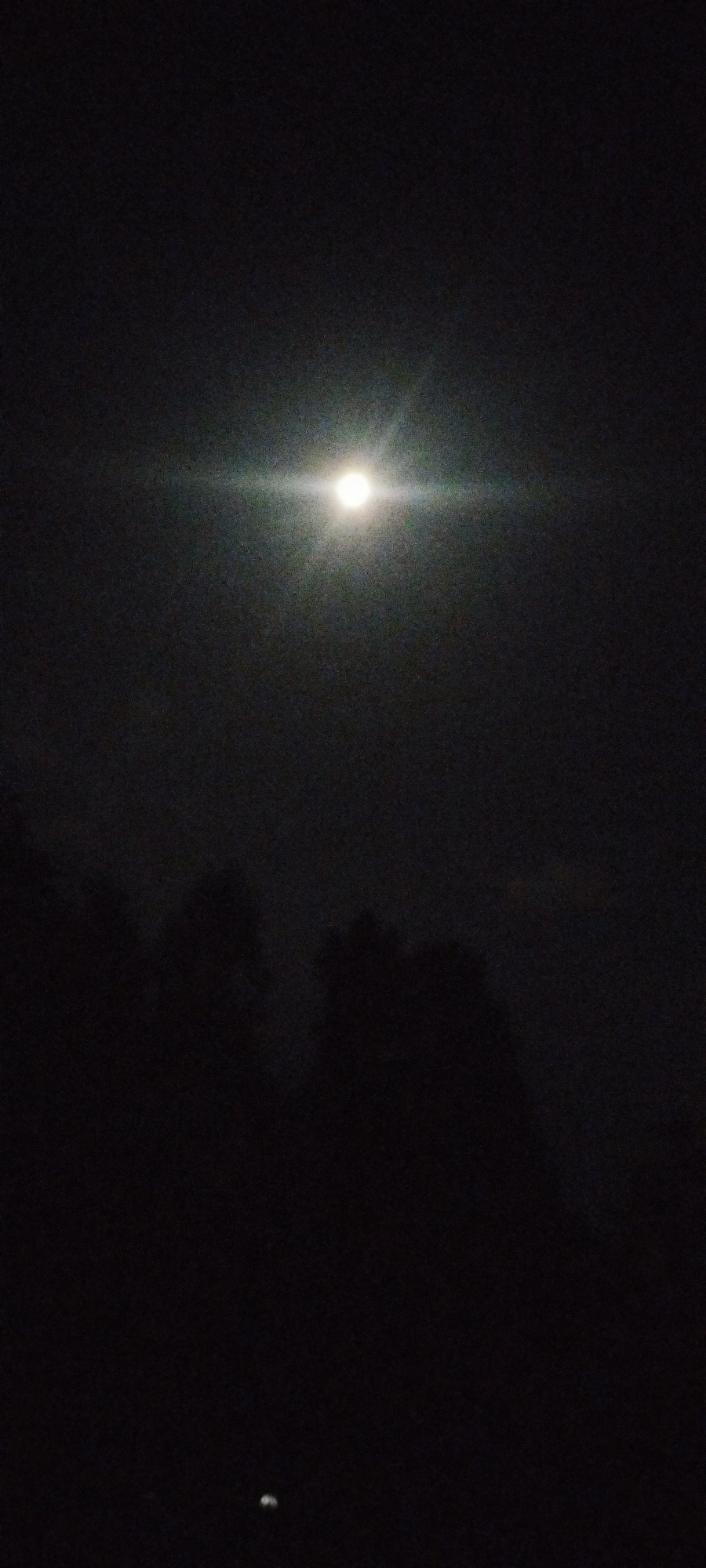 Bright full moon observed over Karateri, Uzbekistan evening sky