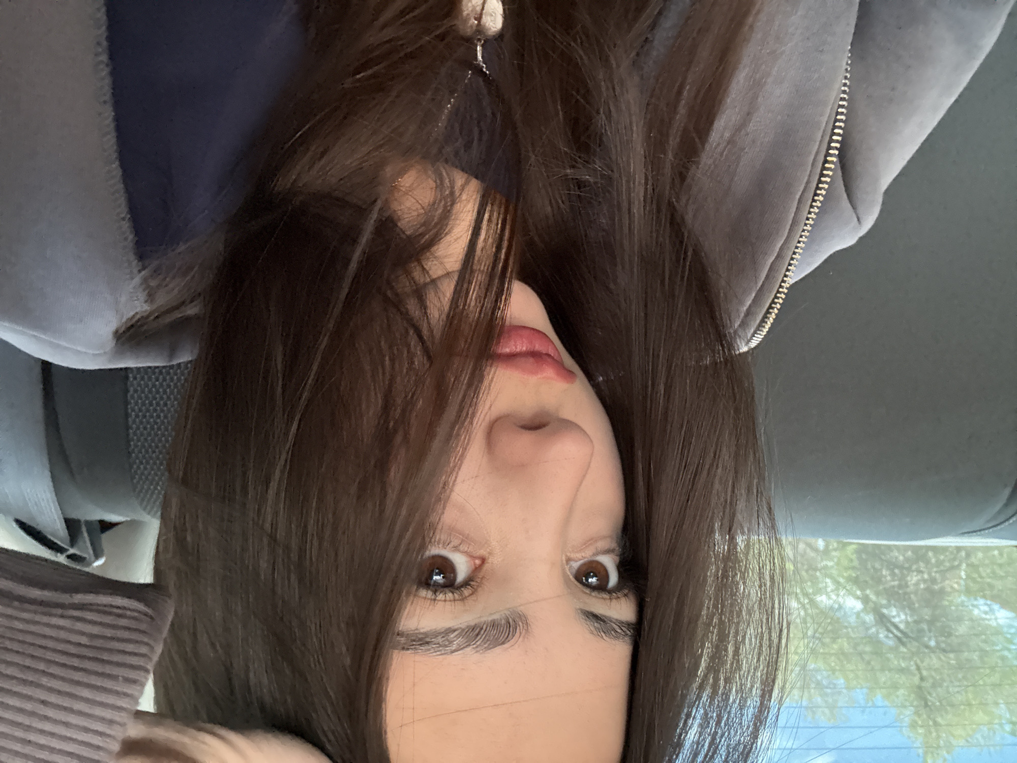 Woman photographed upside down in car backseat in Yerevan