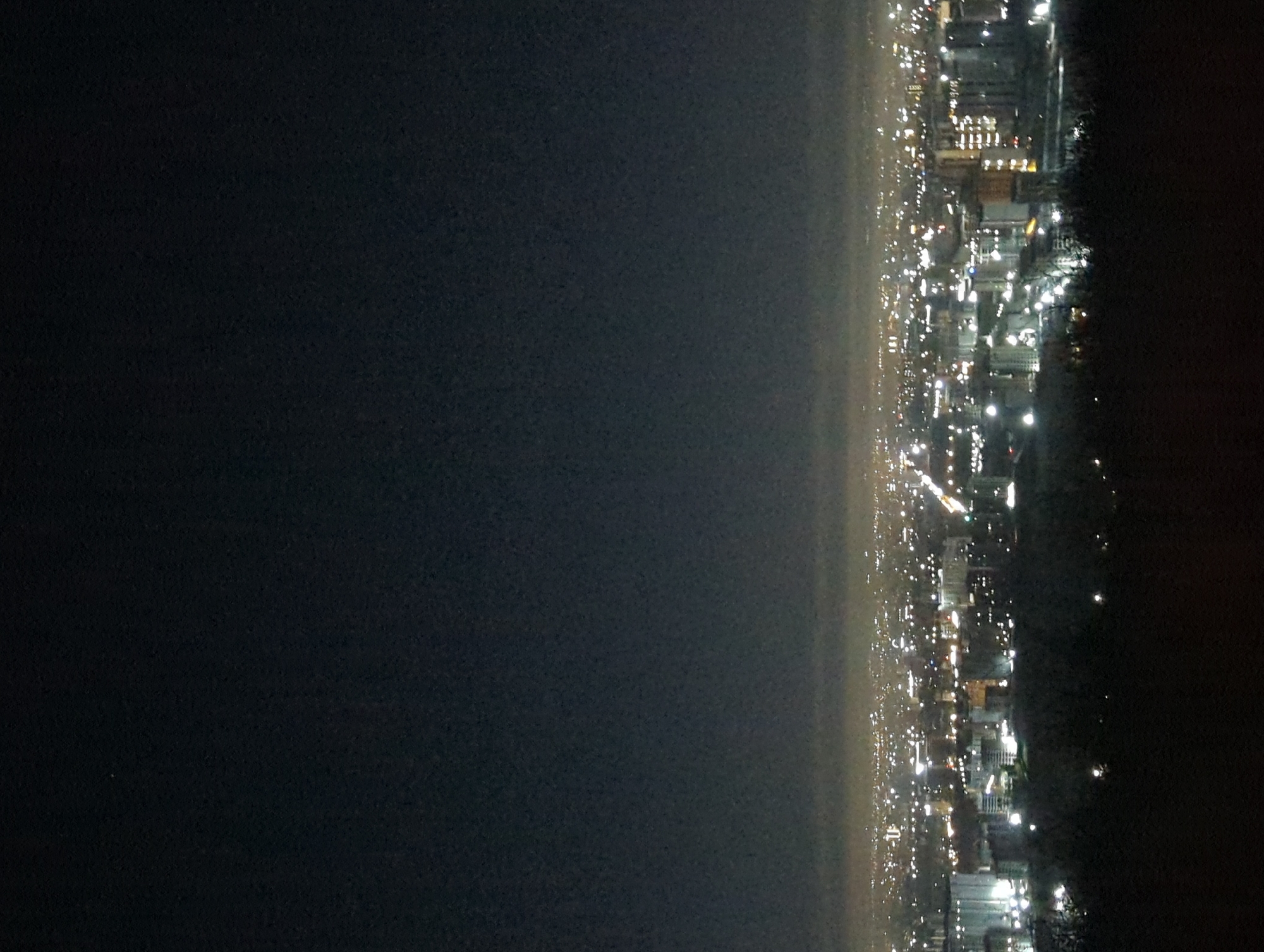 Nighttime aerial views of illuminated Bishkek cityscape captured
