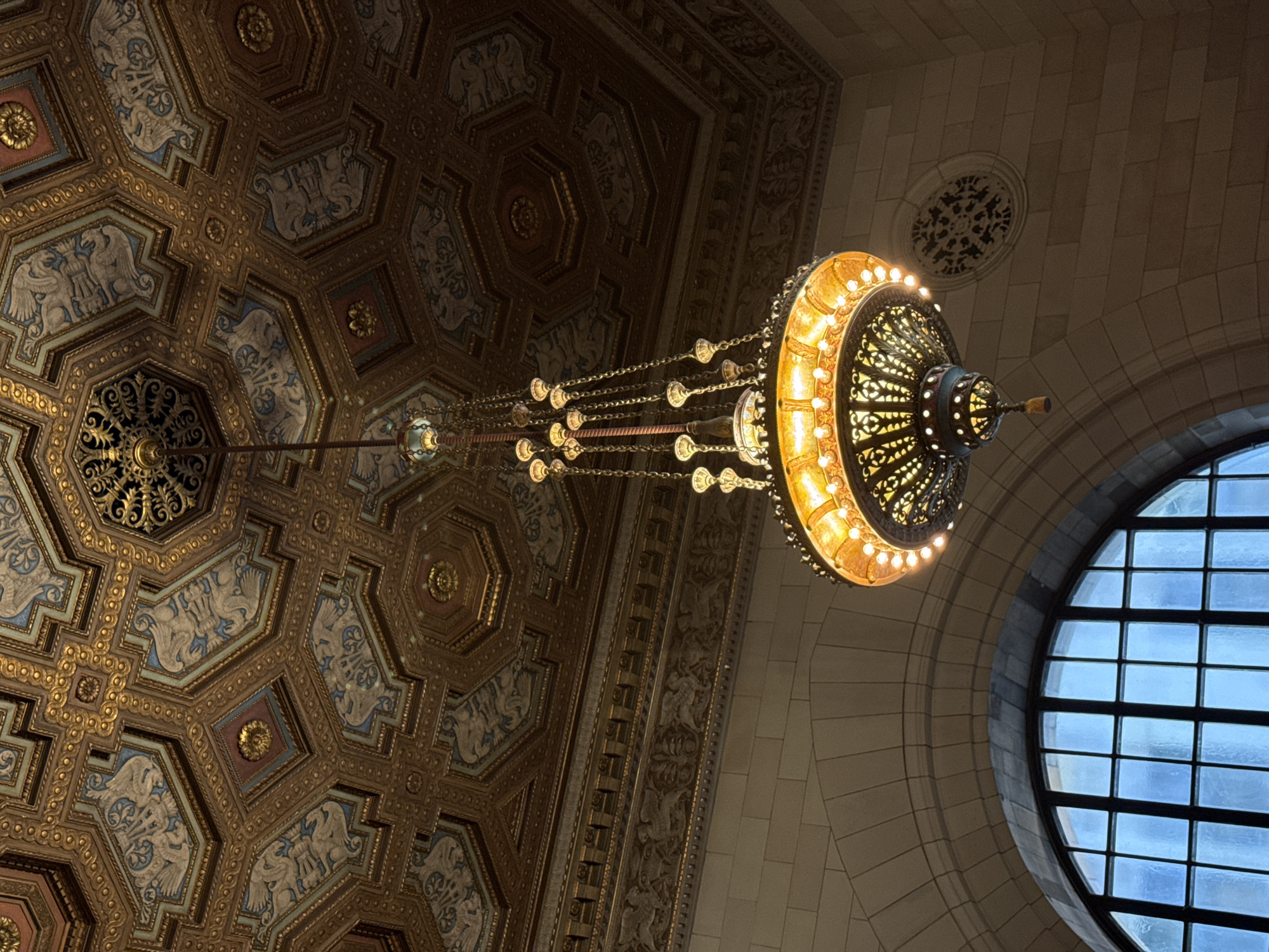Tourists document historic Windsor Station architecture in Montreal