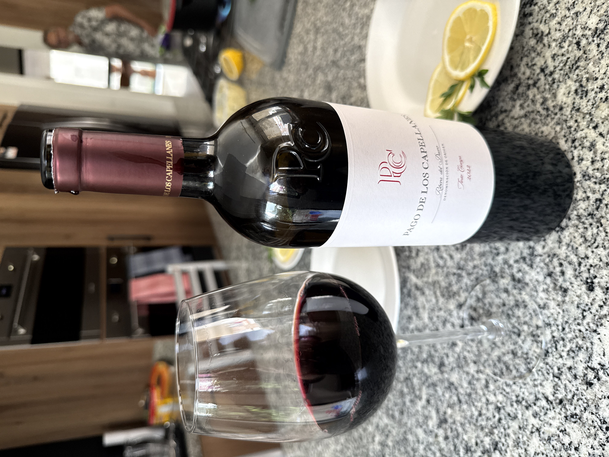 Evening kitchen scenes with wine, citrus documented in Mexican suburb