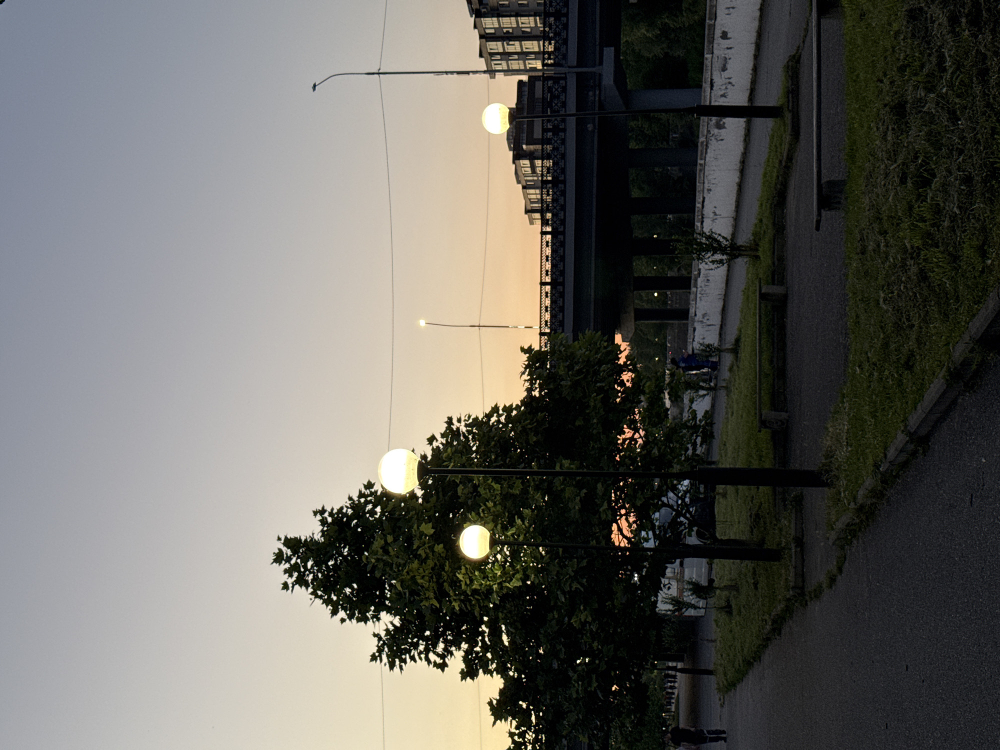 Dusk settles over a quiet street in Kamysh-Gadzhiaul, Russia