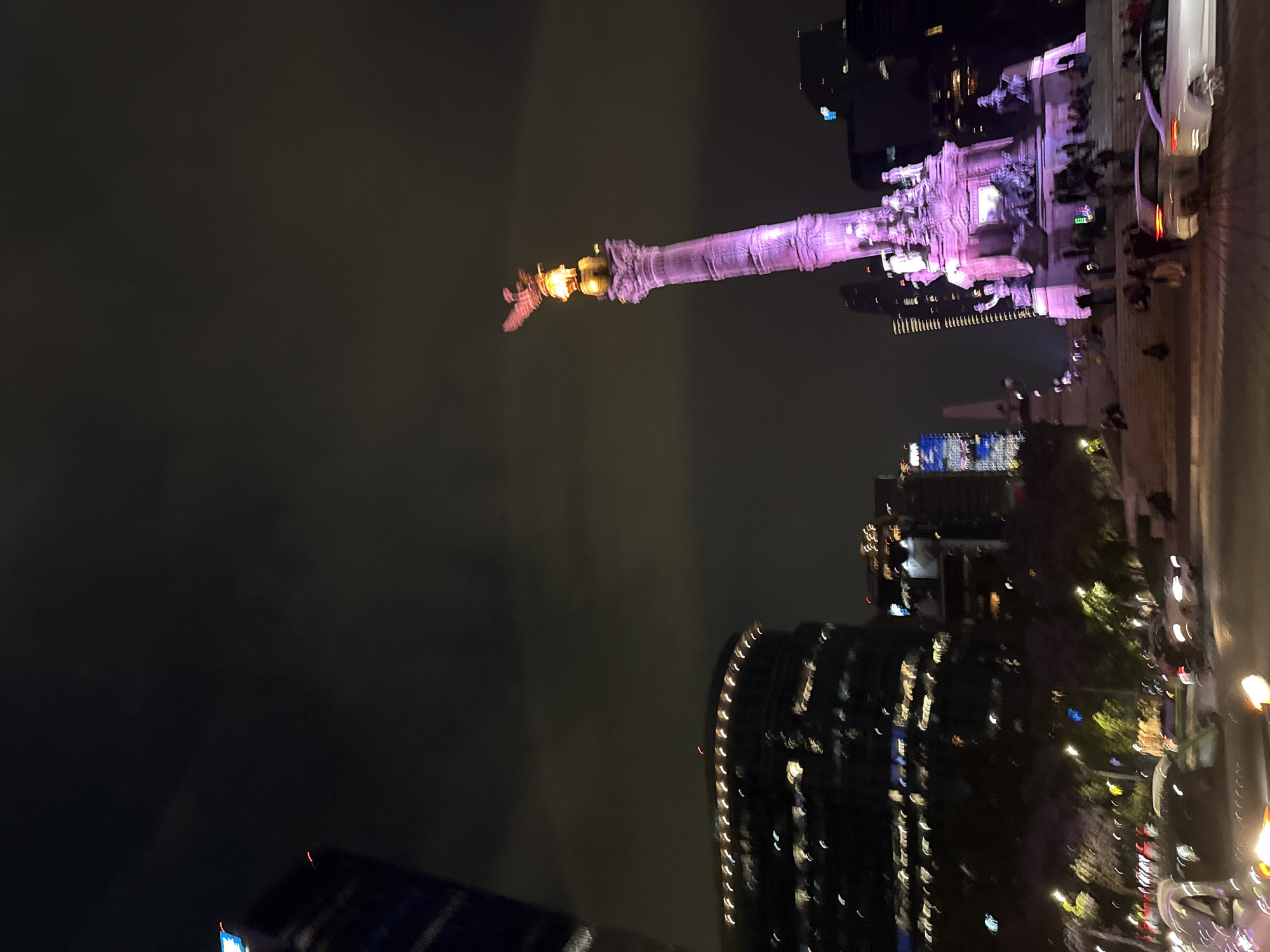 Angel of Independence monument lit purple in Mexico City