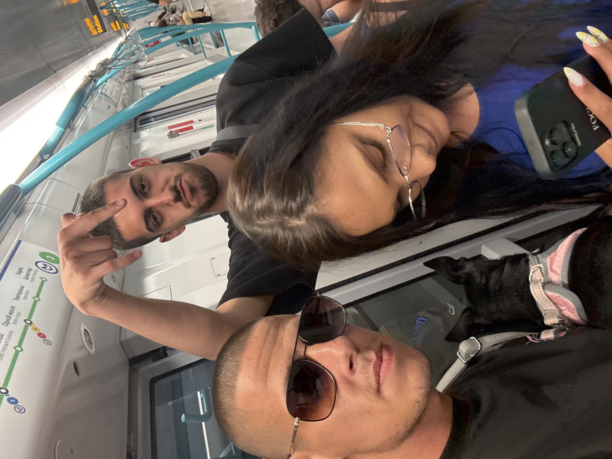 Passengers document casual moments aboard Sofia Metro train