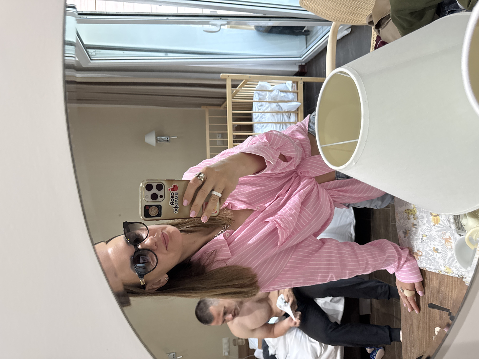 Woman takes mirror selfies in Gagra hotel room