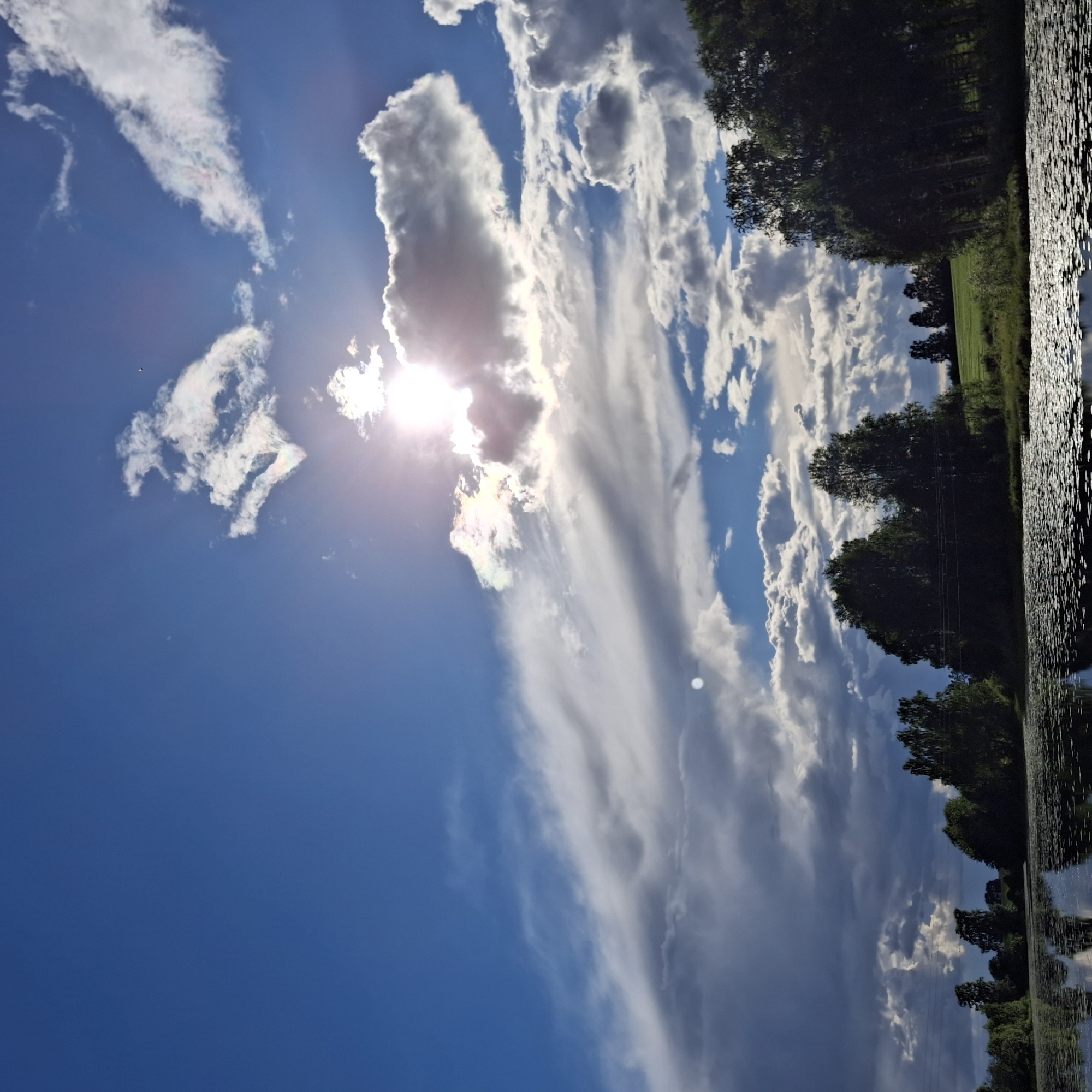 Still Norwegian lake mirrors dramatic summer cloudscape