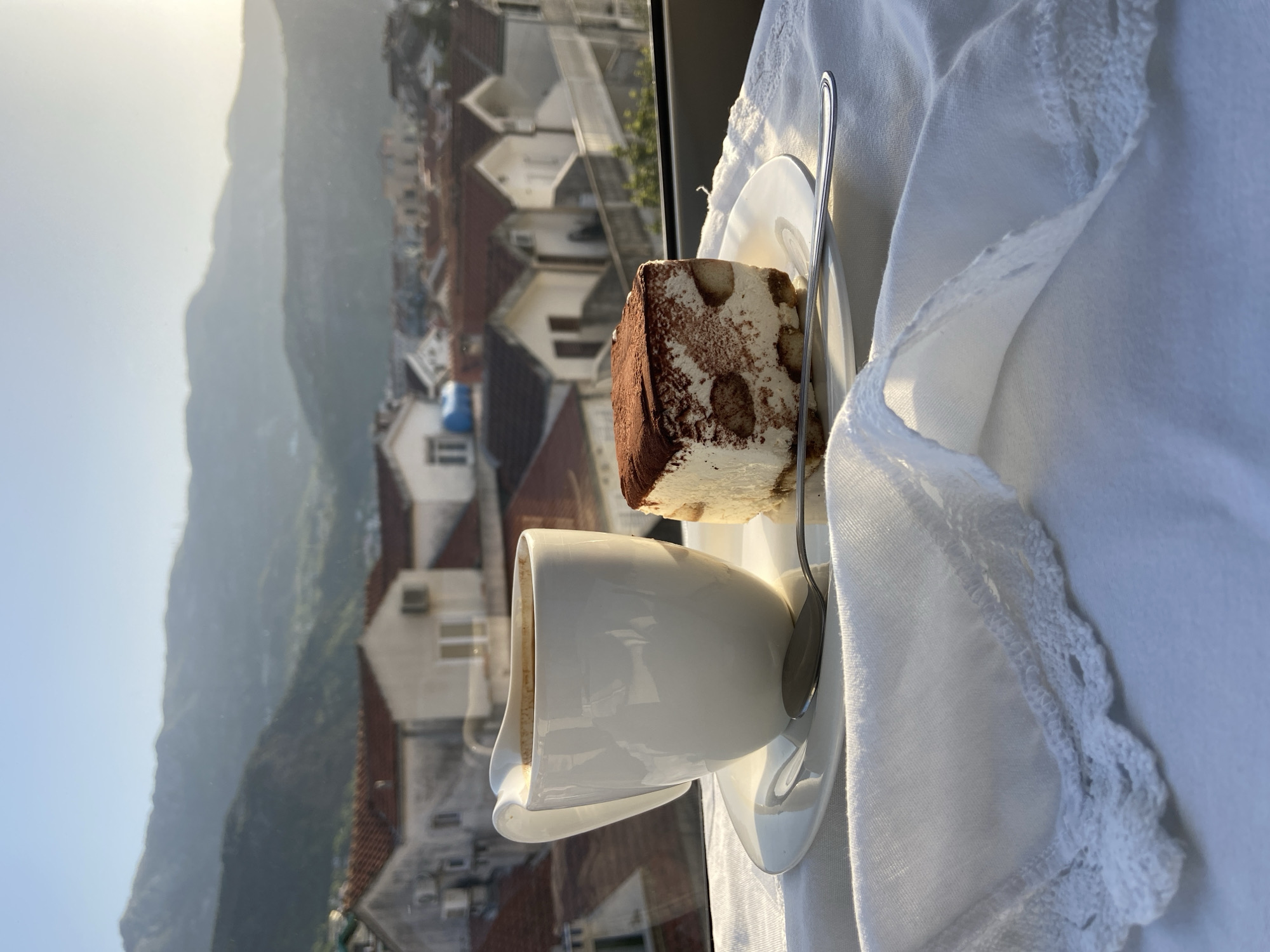 Morning terrace scene captured from elevated view in Budva