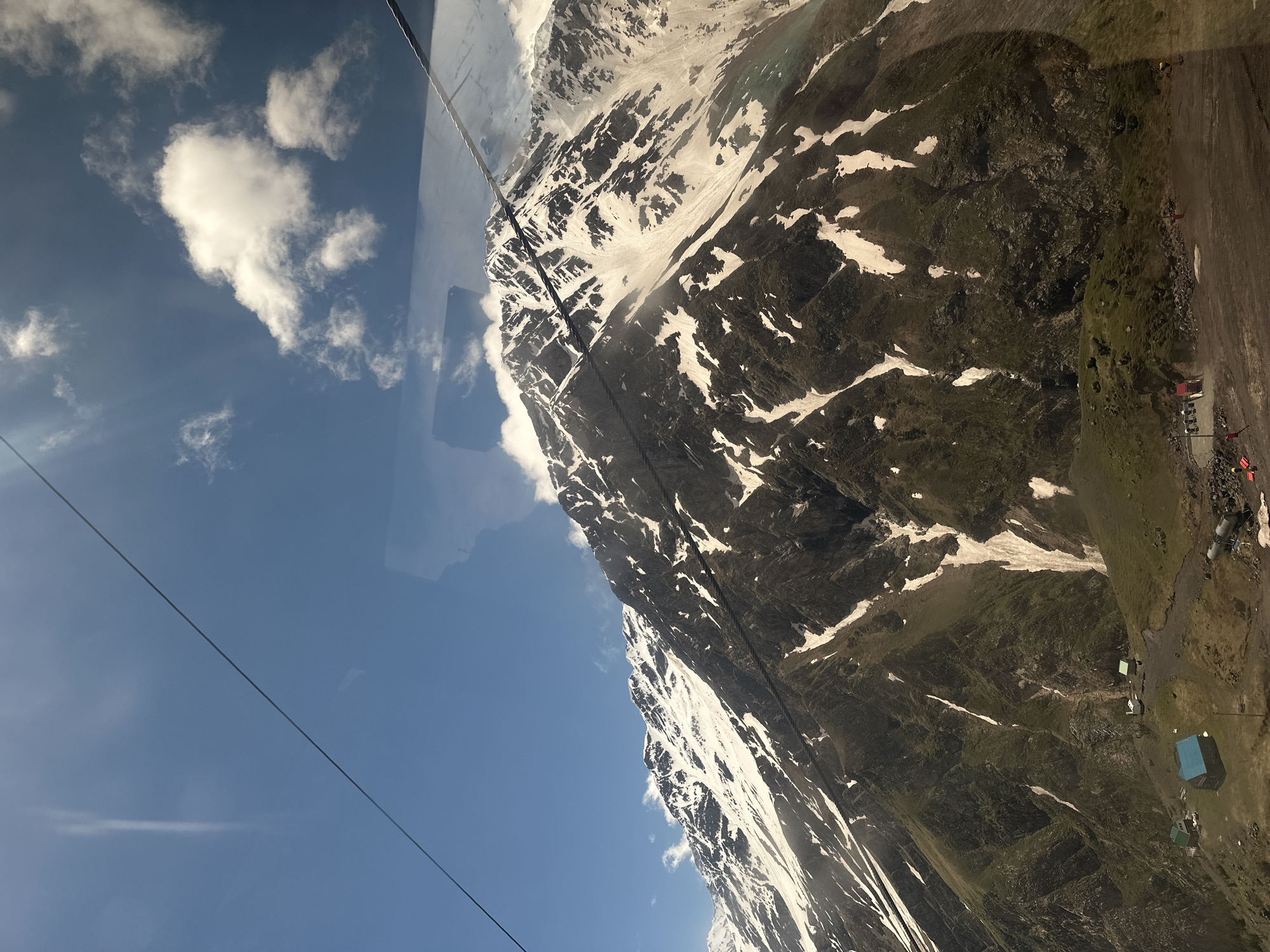 Cable car ascent through Terskol mountains with valley views