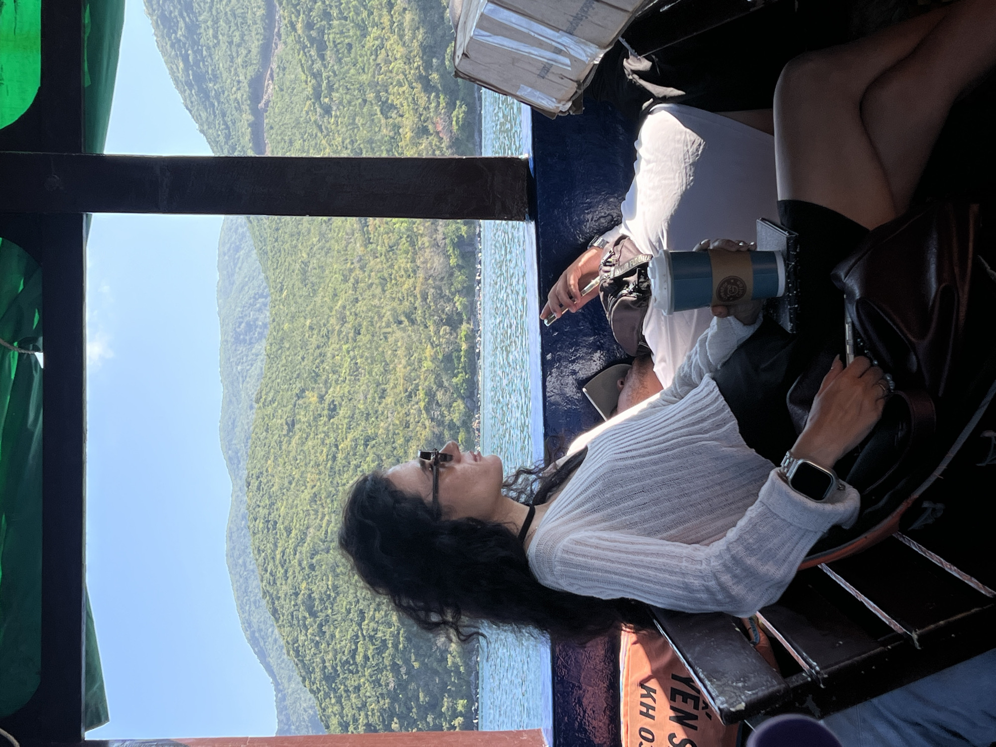Woman relaxes on boat in Nha Trang waters