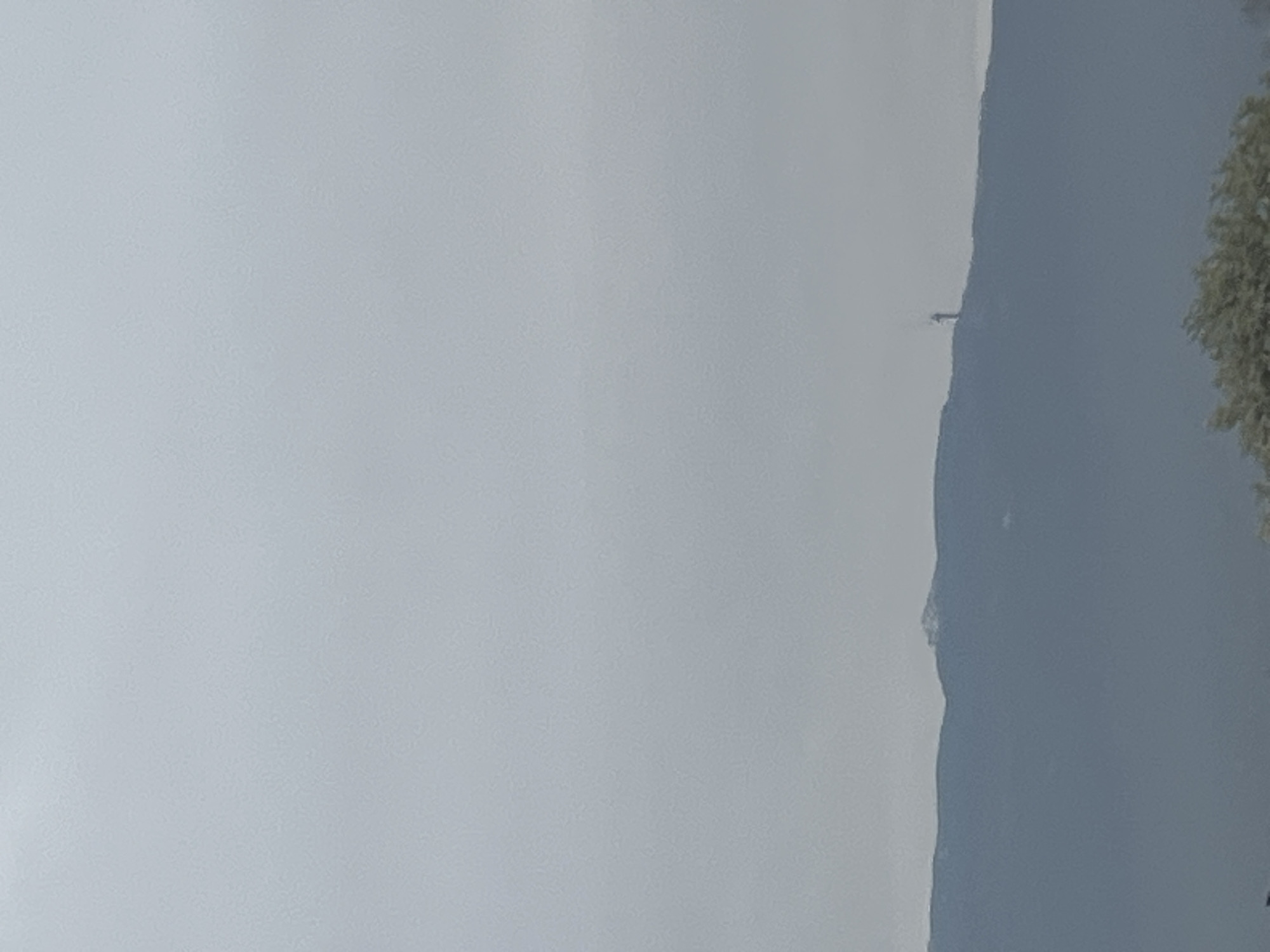 Mountain range observed under heavy cloud cover