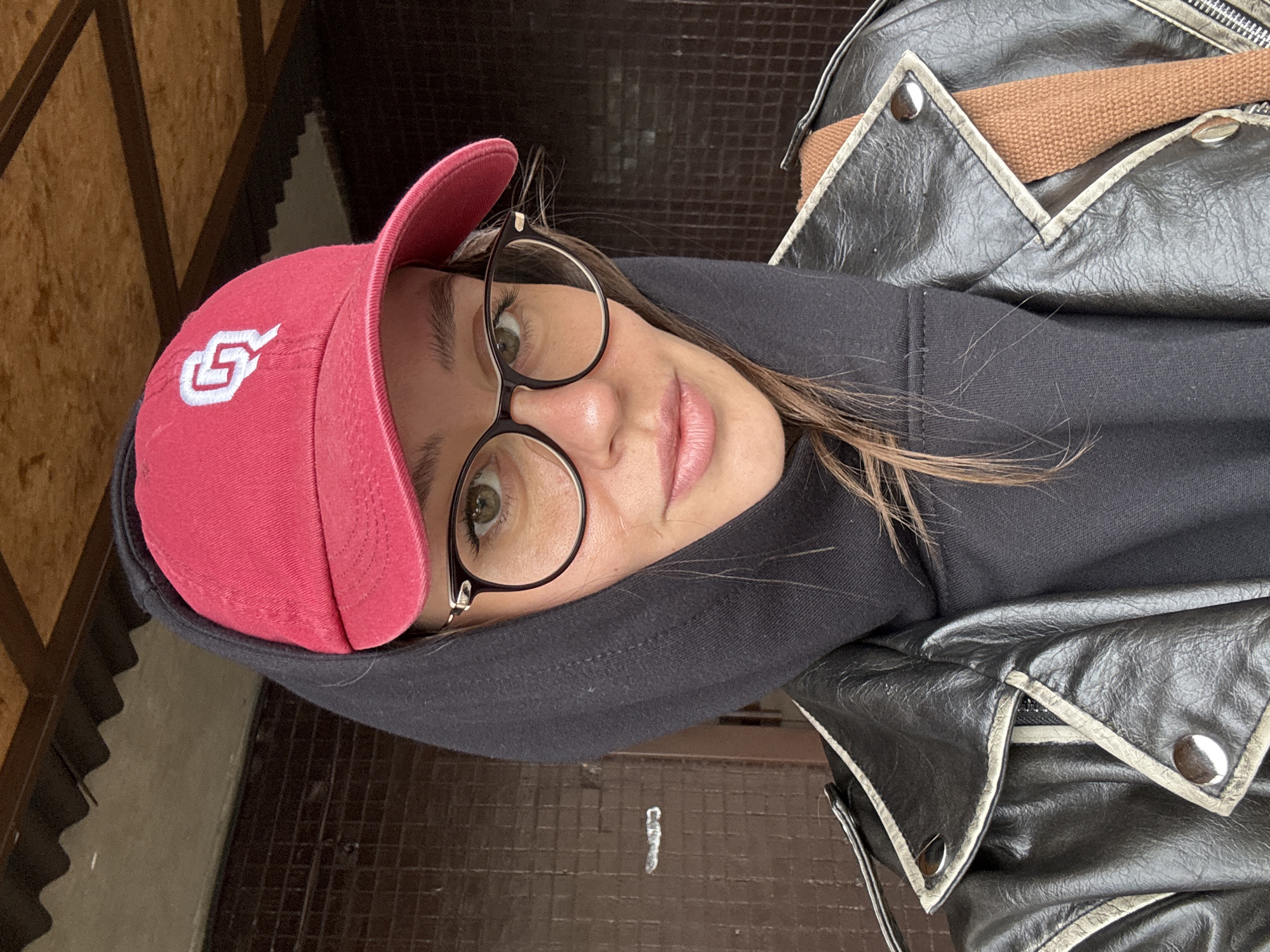 Woman takes selfie in red cap in Krasnoyarsk