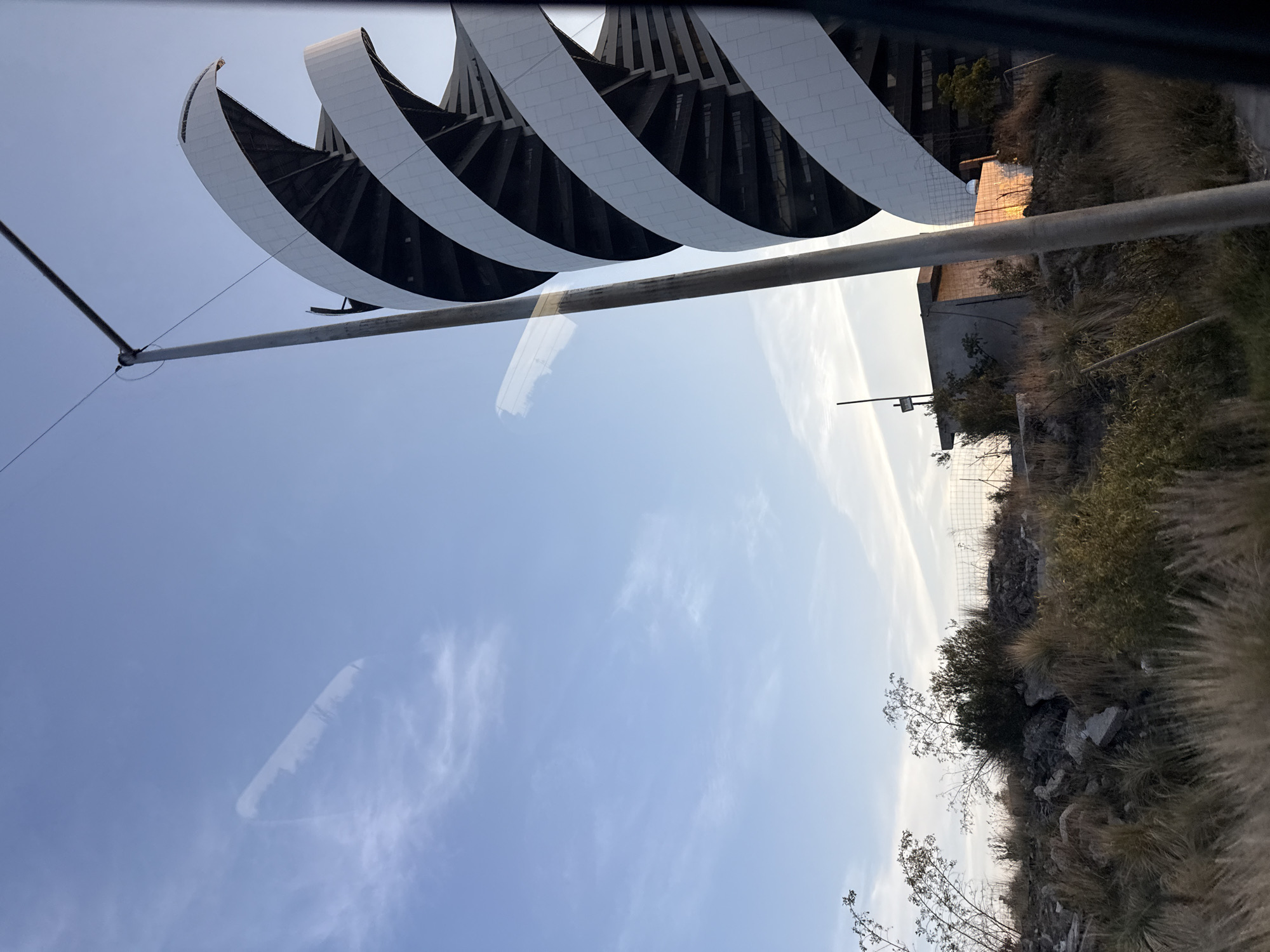 White curved architecture photographed in Mexican hillside community