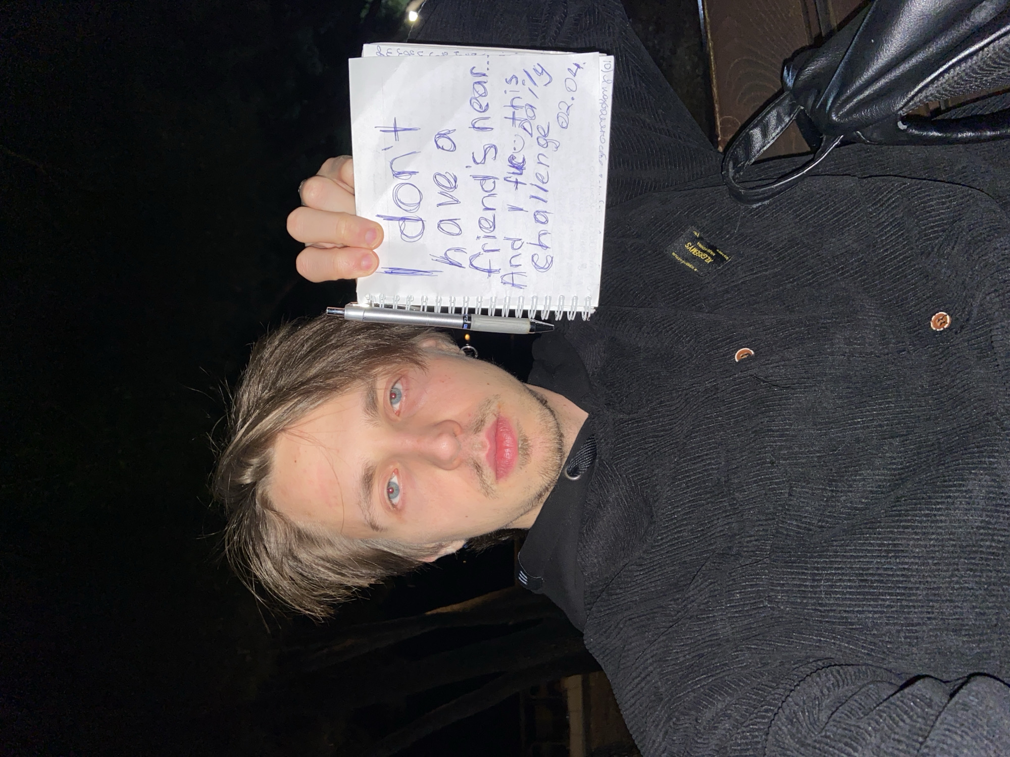 Man documents personal feelings in notebook near Montenegro beach