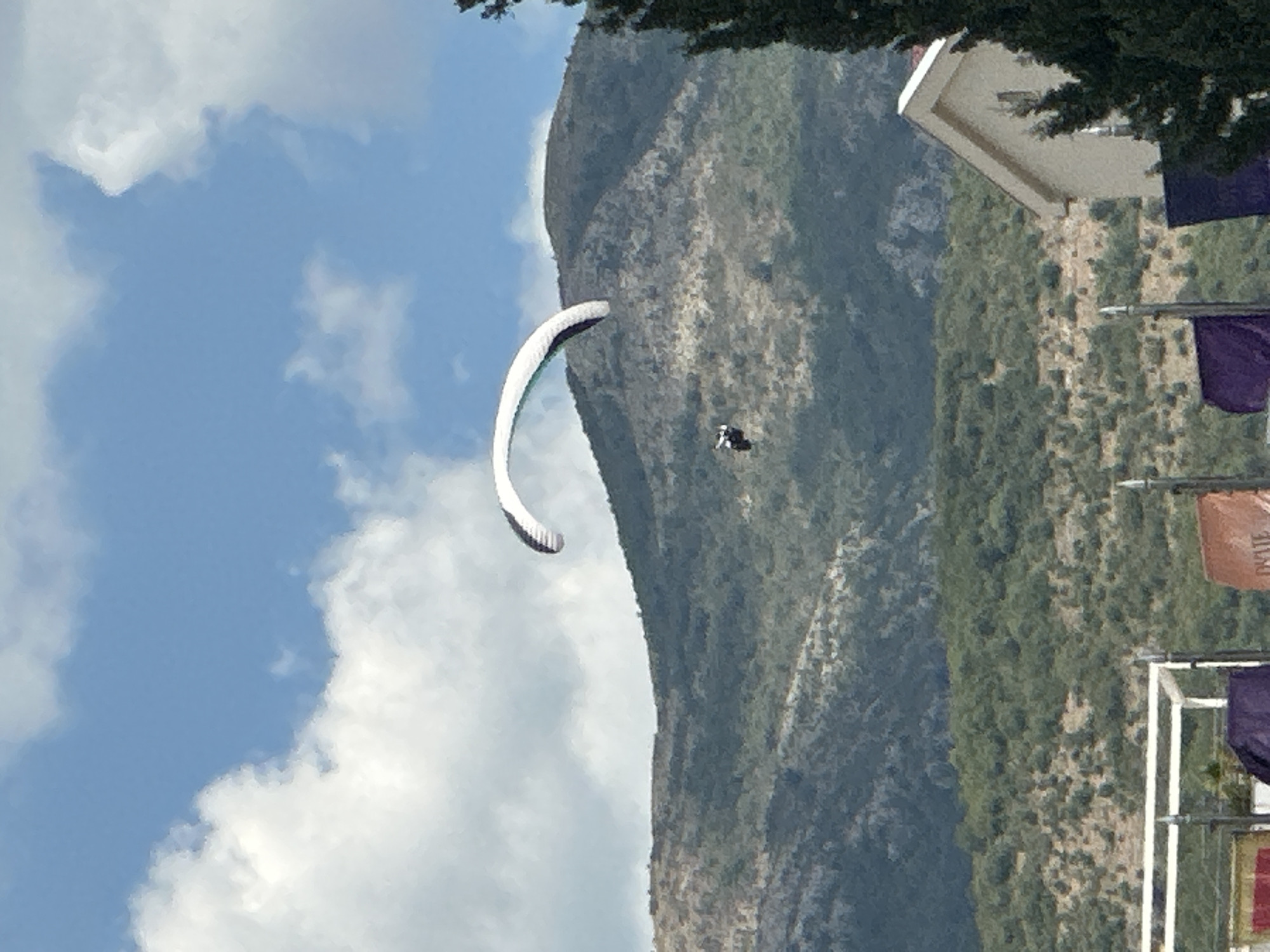 Paragliders soar over Montenegro's Adriatic coastline