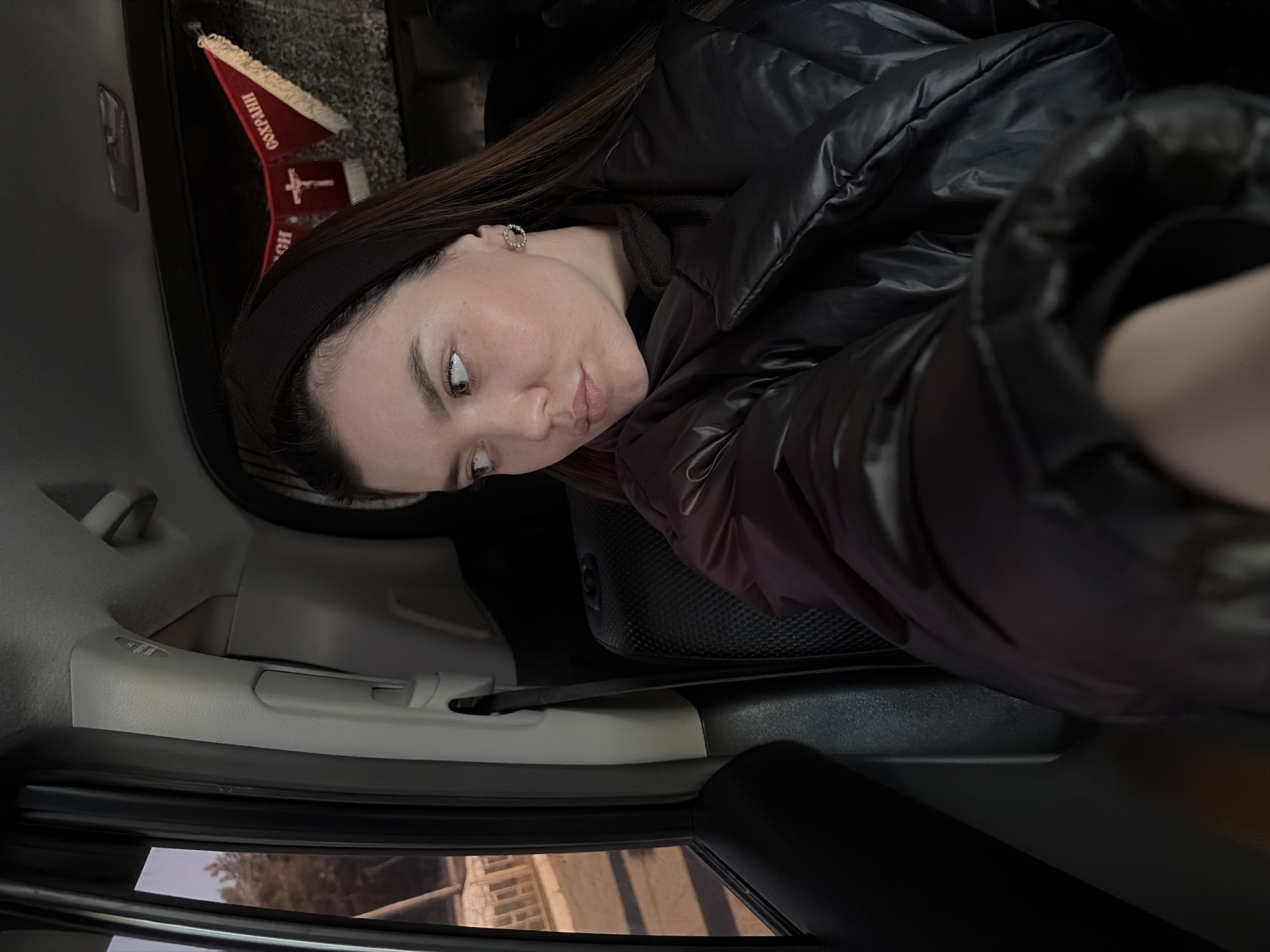 Woman photographed in car during afternoon in Chaikovsky, Russia