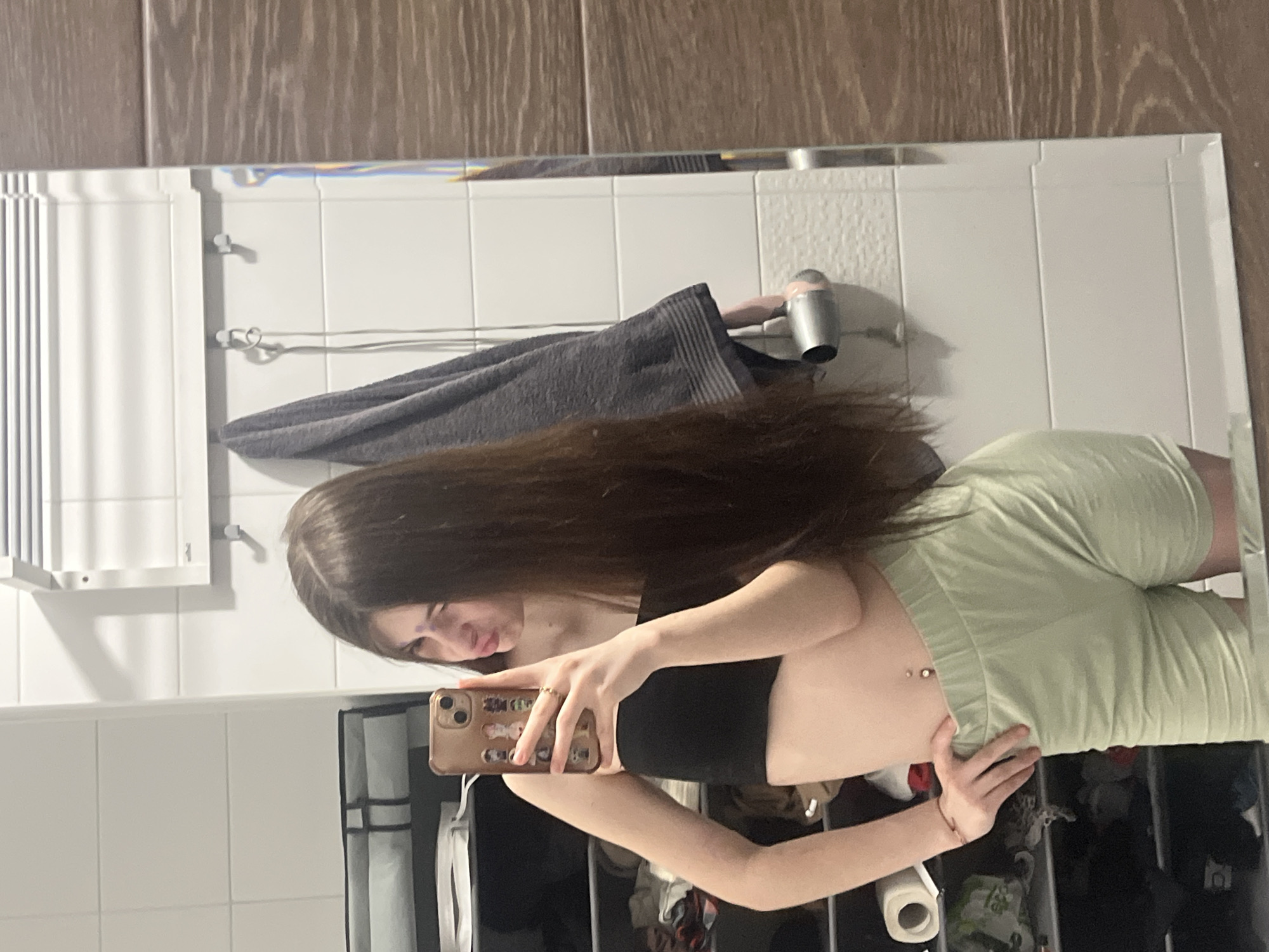 Woman takes bathroom mirror selfies in Saint Petersburg
