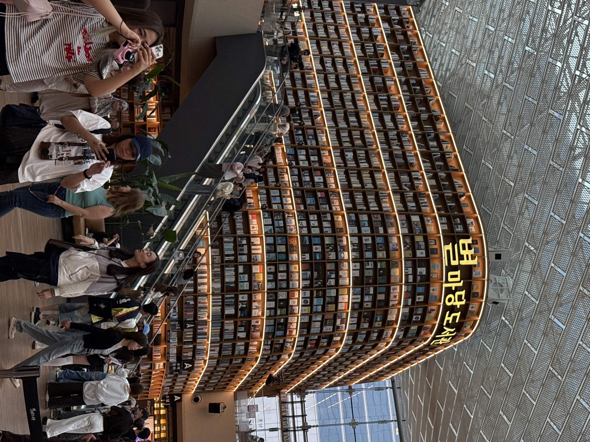 Morning visitors explore Seoul's illuminated Starfield Library attraction