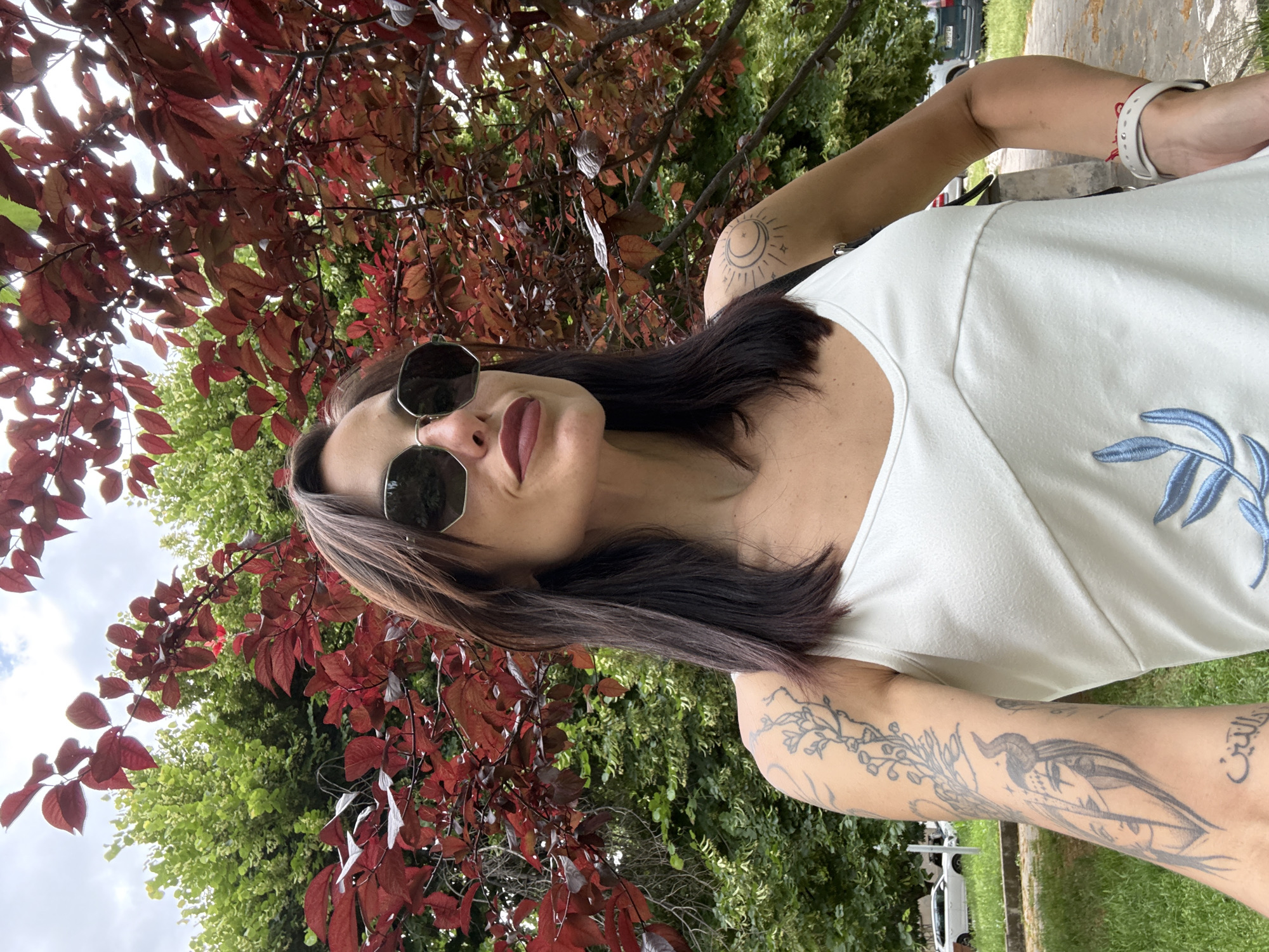 Woman takes selfies in park area in Pleven, Bulgaria