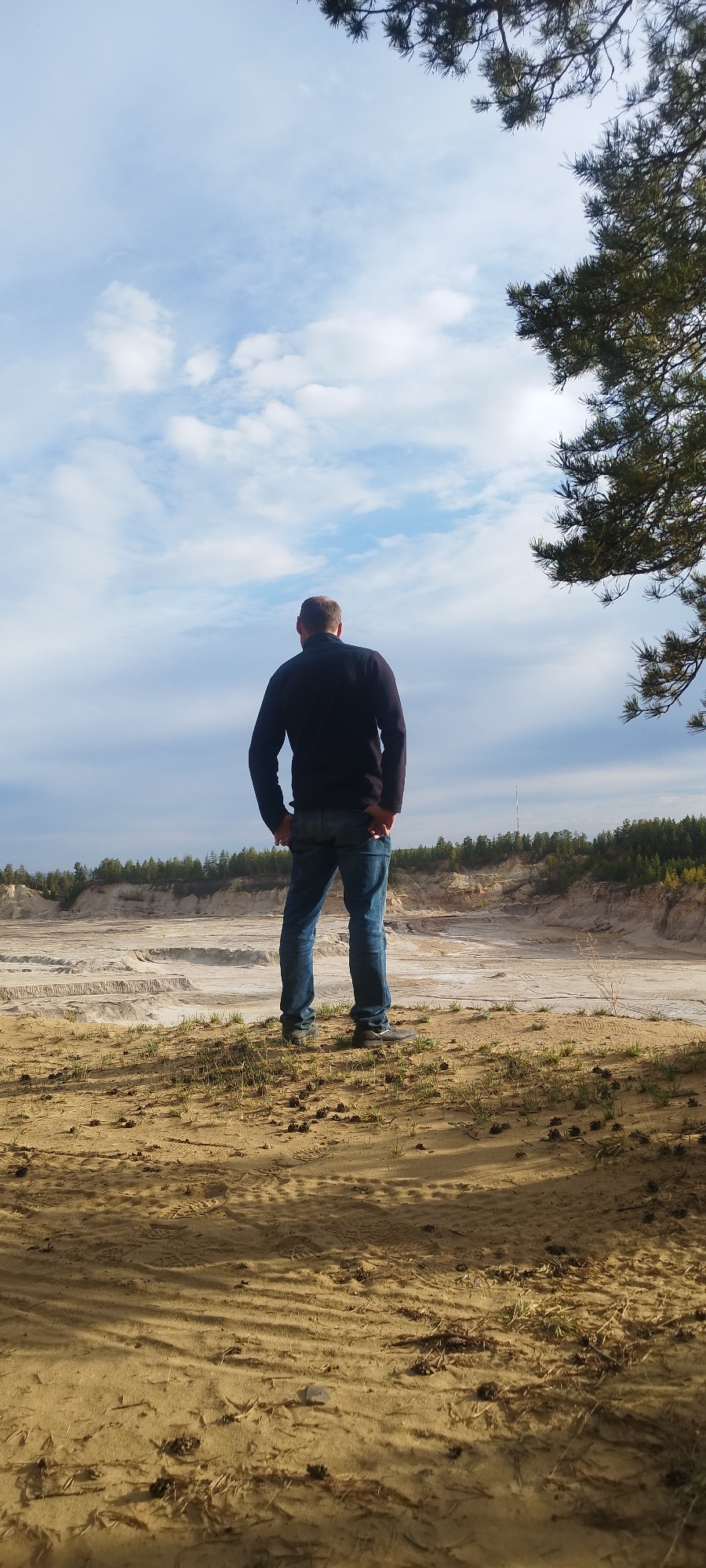 Person explores sandy terrain and wildlife tracks near Yakutsk