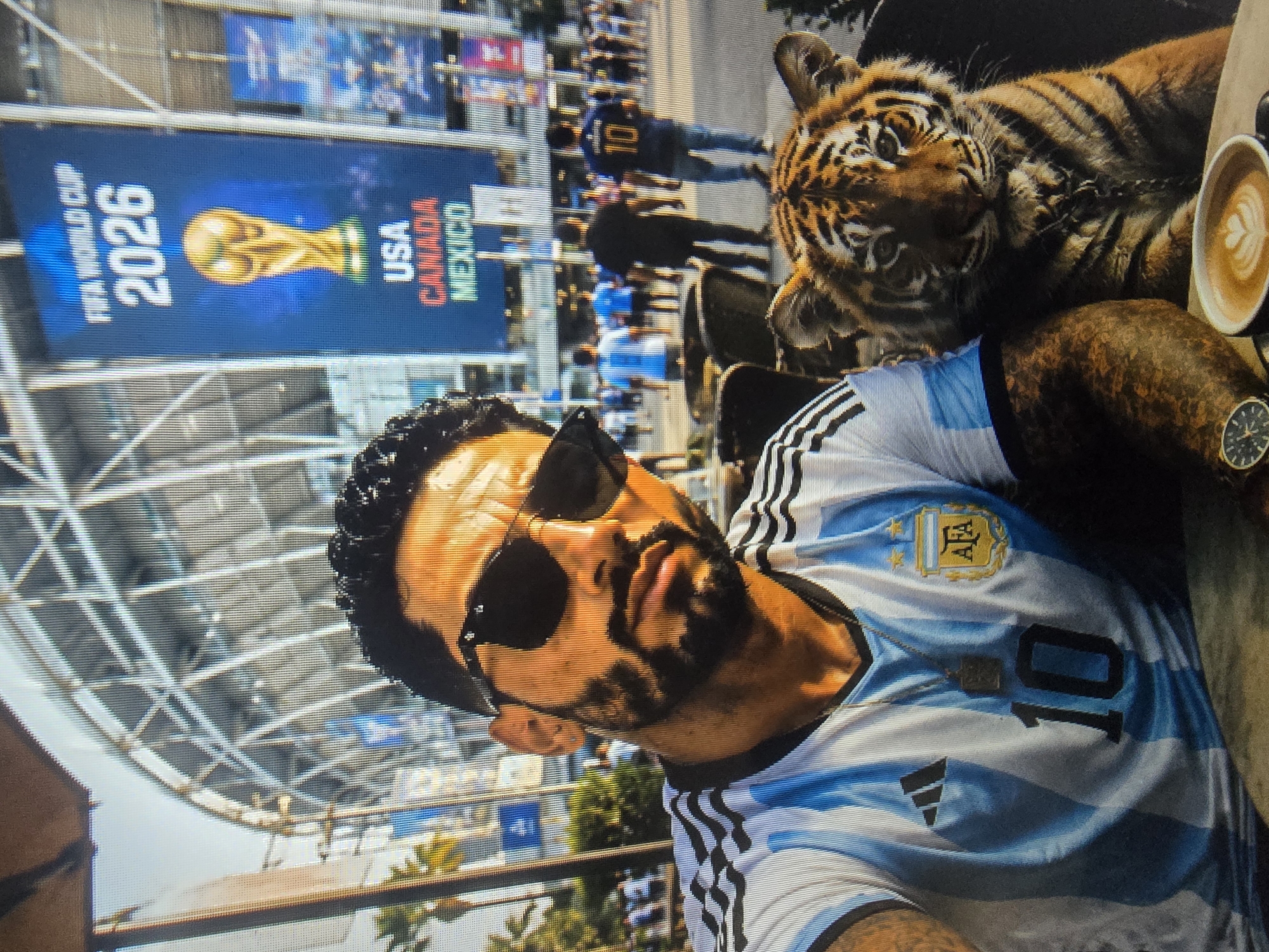 Argentina jersey, stadium crowd, and a tiger
