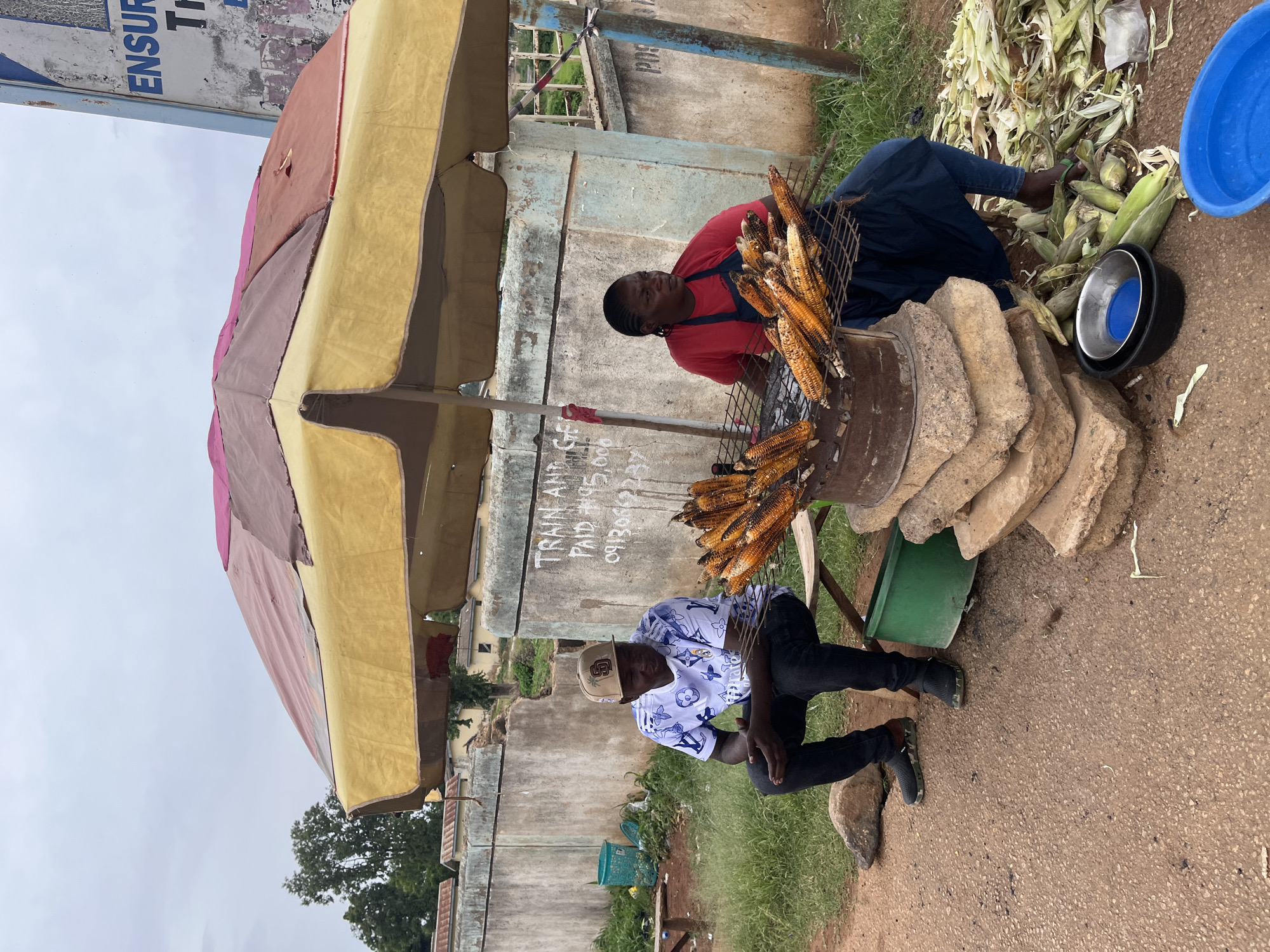 Everyday street life across Jos on a grey afternoon