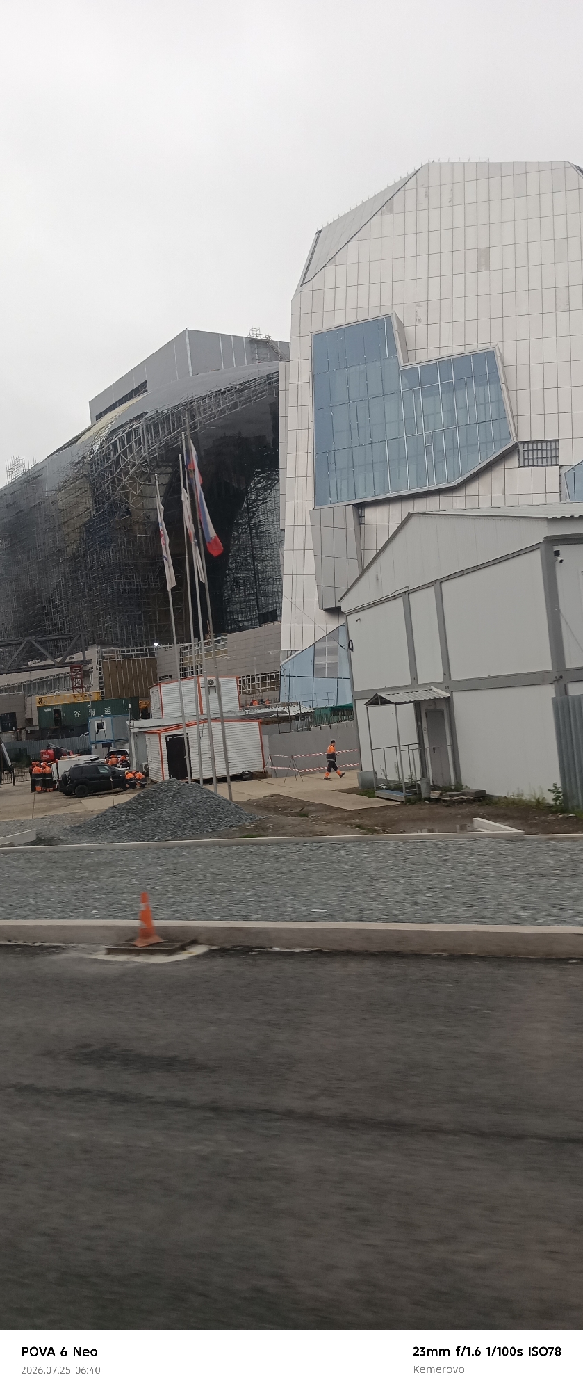 Construction zone and quiet street in Kemerovo on a grey morning