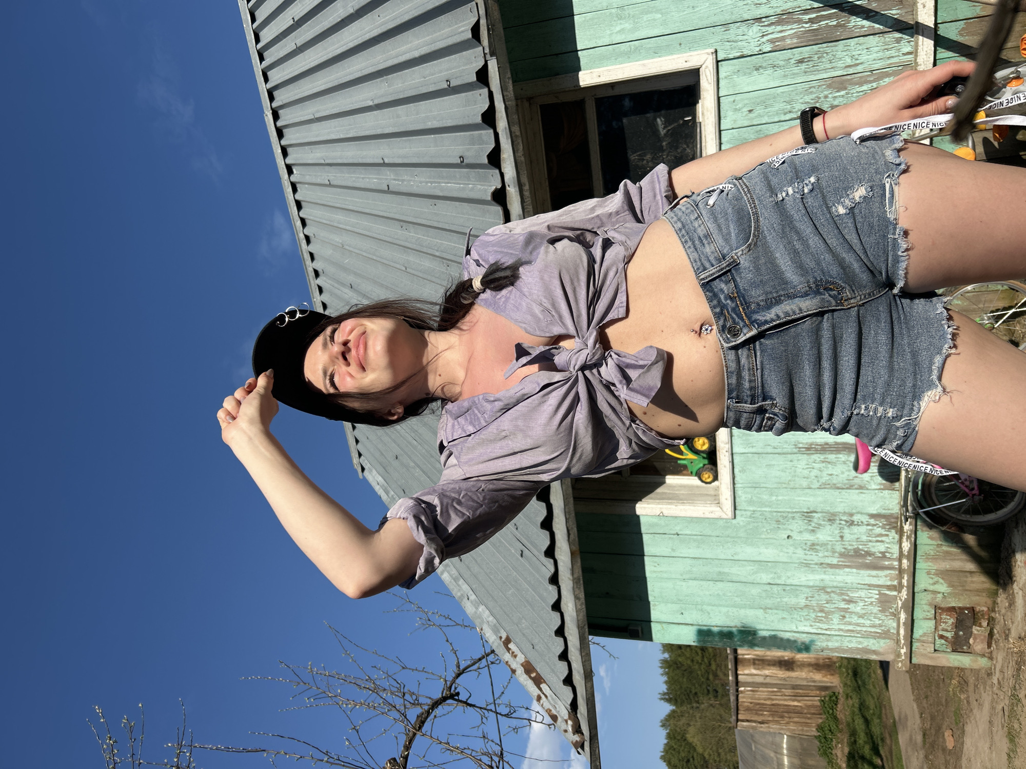 Woman poses for outdoor photo session in Rusalevka, Russia