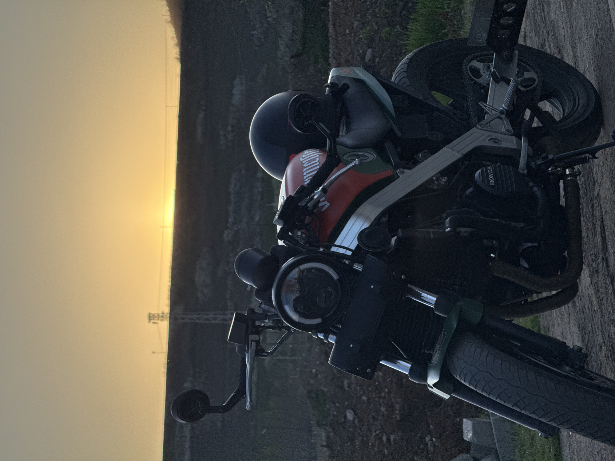 Motorcyclist takes sunset break in rural Montana, Bulgaria