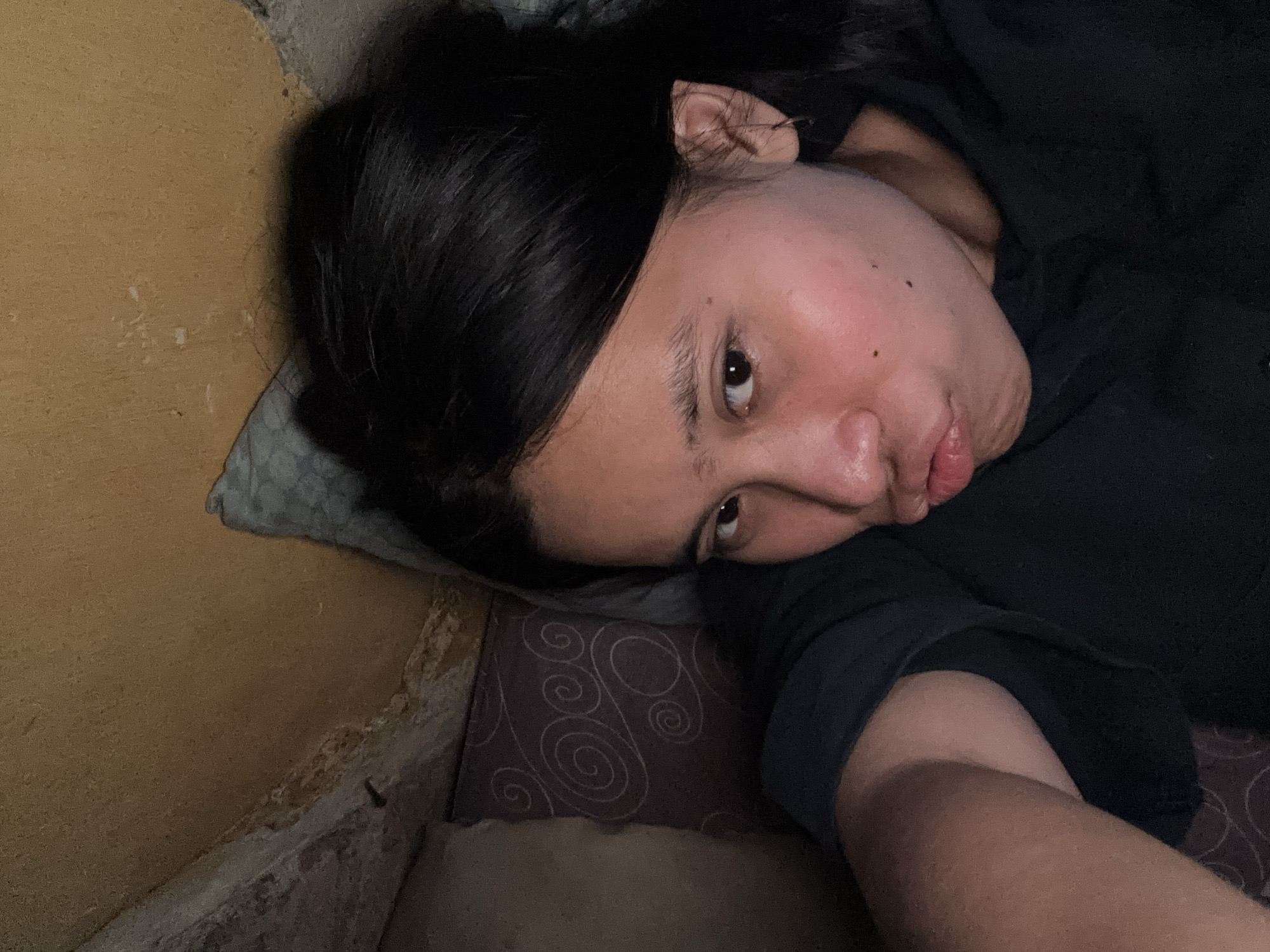 Lazy afternoon selfie session on a bed in East Jakarta