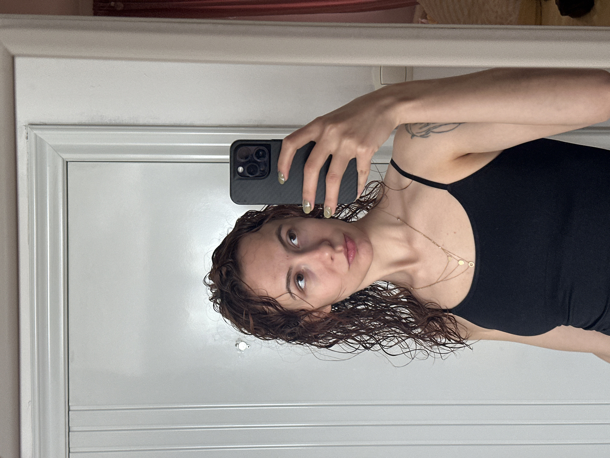 Woman photographs herself in Novi Sad apartment morning scene